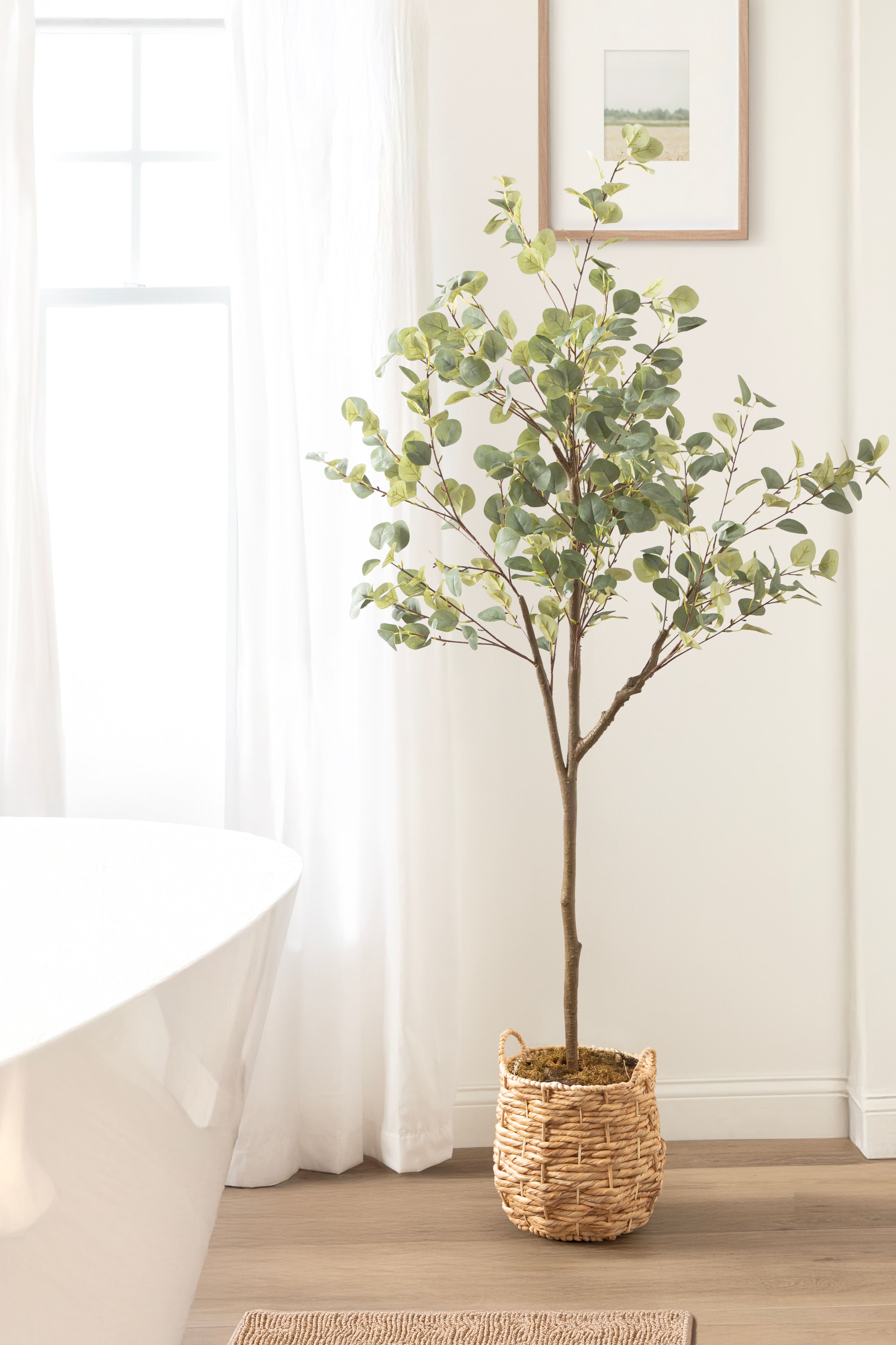 Kate and Laurel 6ft. Eudora Faux Eucalyptus Tree with Natural Planter