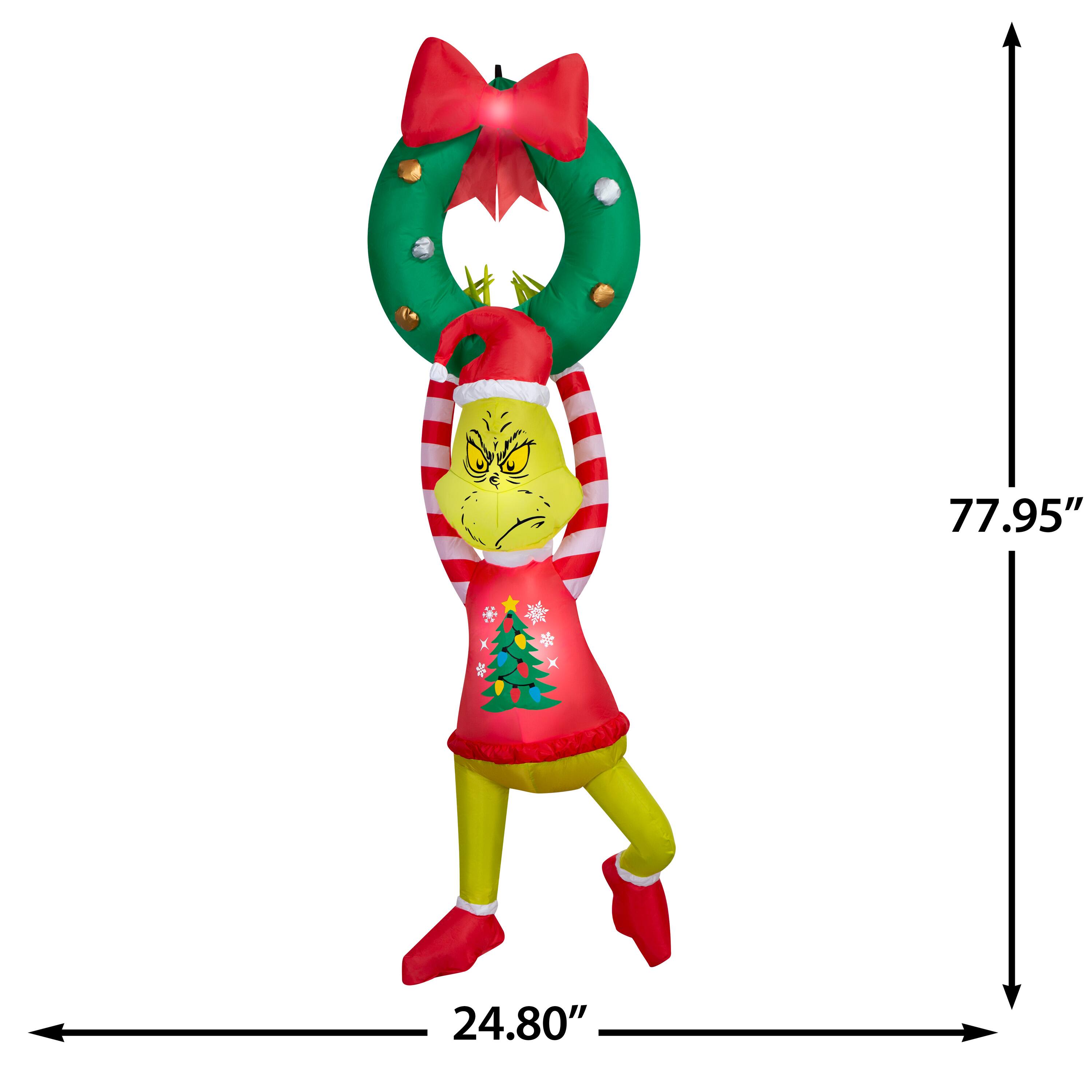 6.5ft. Airblown® Dr. Seuss™ Inflatable Grinch Hanging from Wreath with Red Bow Christmas Light Décor