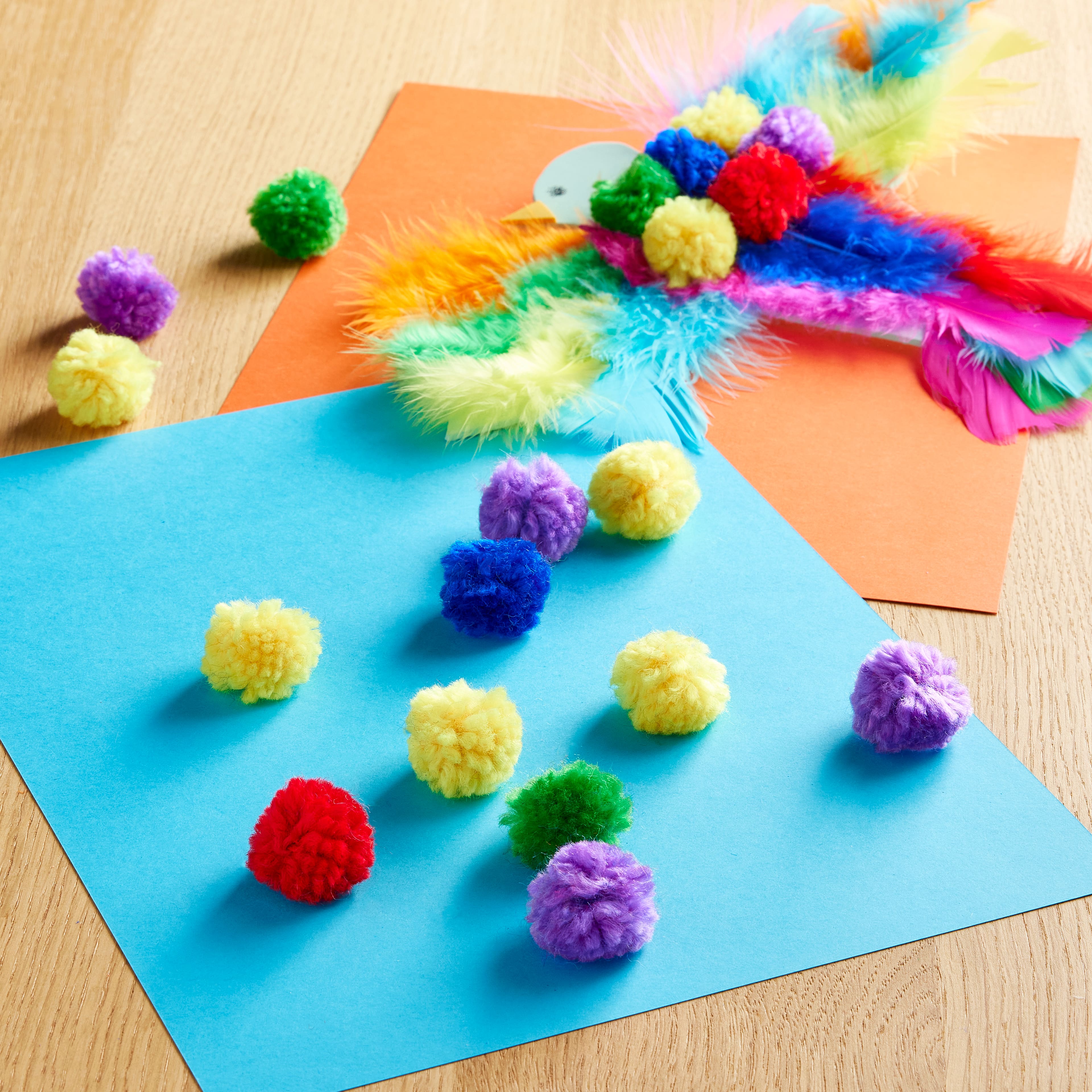 12 Packs: 60 ct. (720 total) Rainbow Yarn Pom Poms by Creatology™