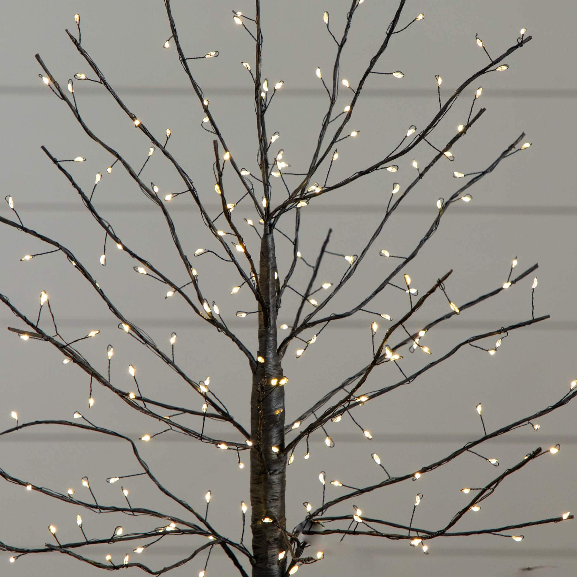 2ft. Pre-Lit Artificial Halloween Black Twig Tree with 210 Warm White Fairy Copper Wire LED Lights