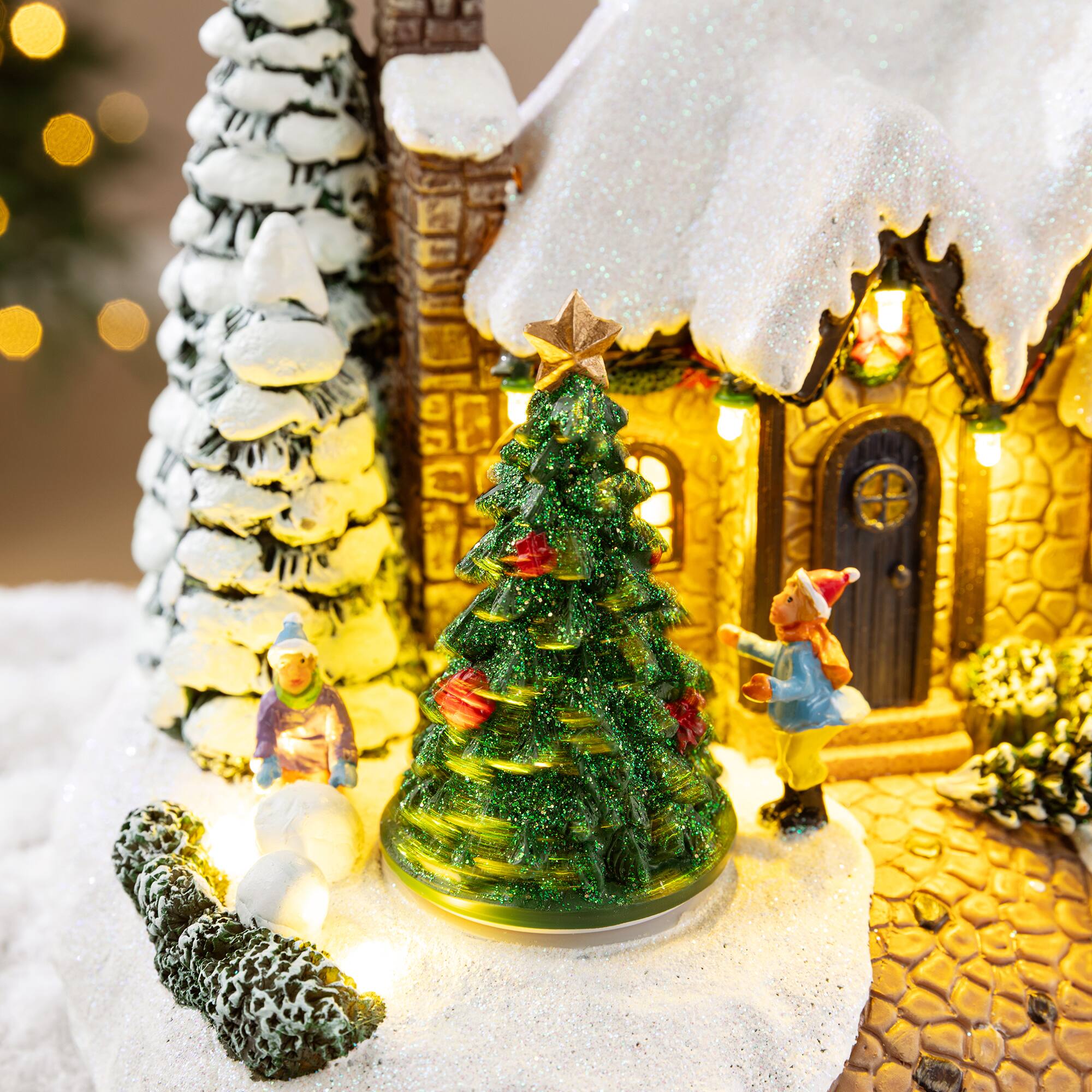 Glitzhome® 9.5" Lighted Christmas Snowy Musical Resin Village with Movement and Timer