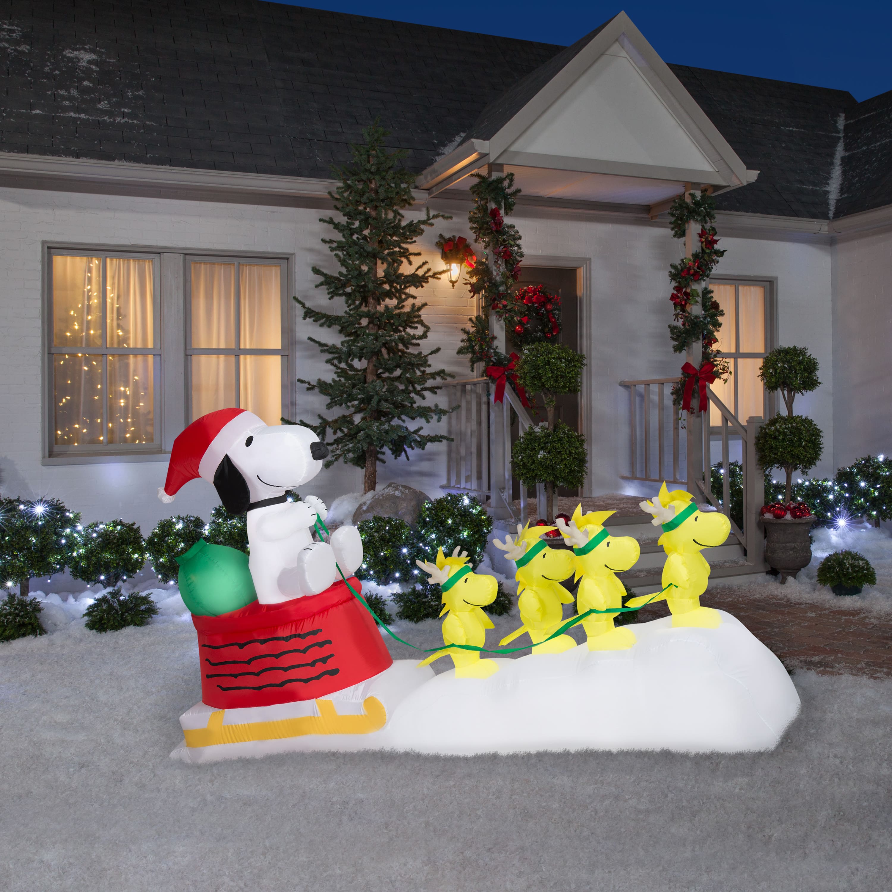 5ft. Airblown® Inflatable Snoopy in Dog Bowl Sleigh with Woodstocks