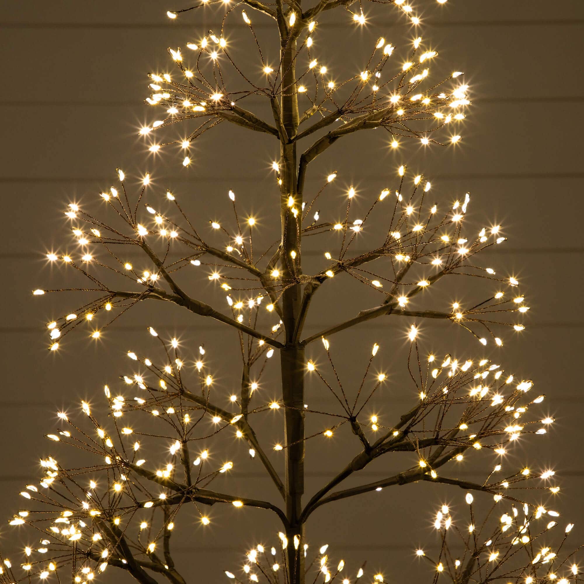 4ft. Pre-Lit Artificial Halloween Black Starburst Tree with 800 Fairy Warm White LED Lights