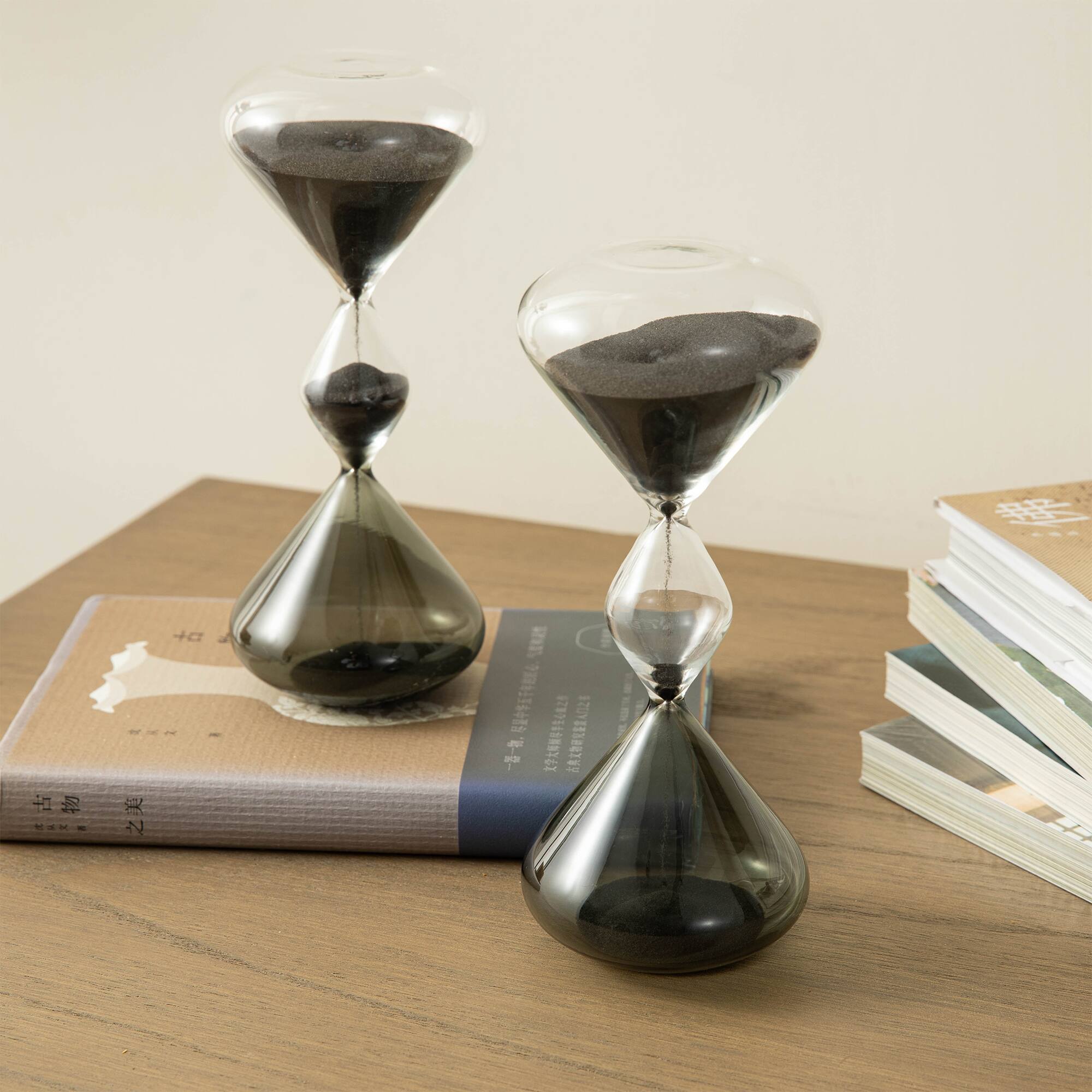 Glitzhome® 7.75" Tri-Layer Two-Tone Color Hourglasses with Black Sand, 2ct.