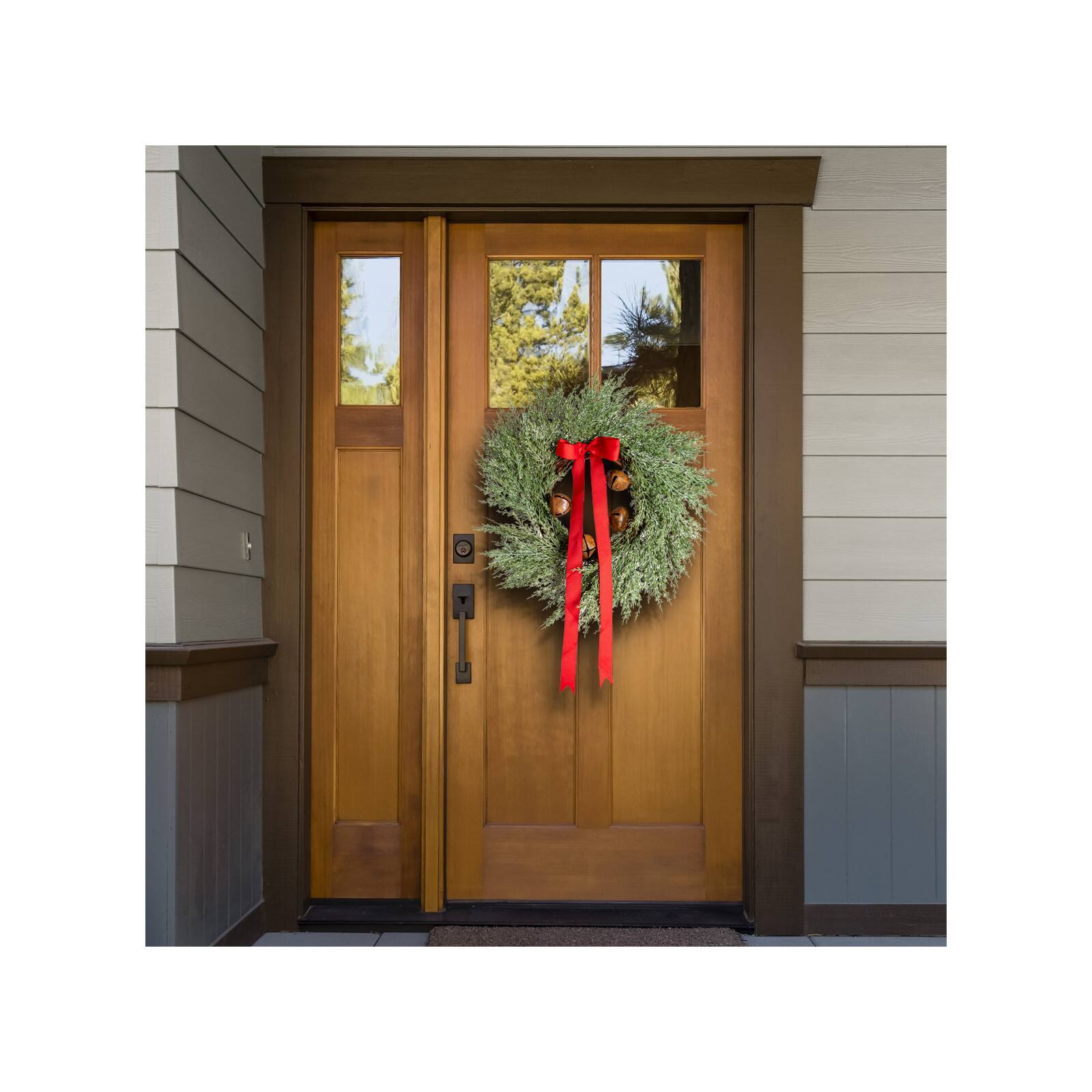 Hello Honey® 24" Round Mixed Pine Wreath with Red Ribbon & Rust Finish Metal Bells