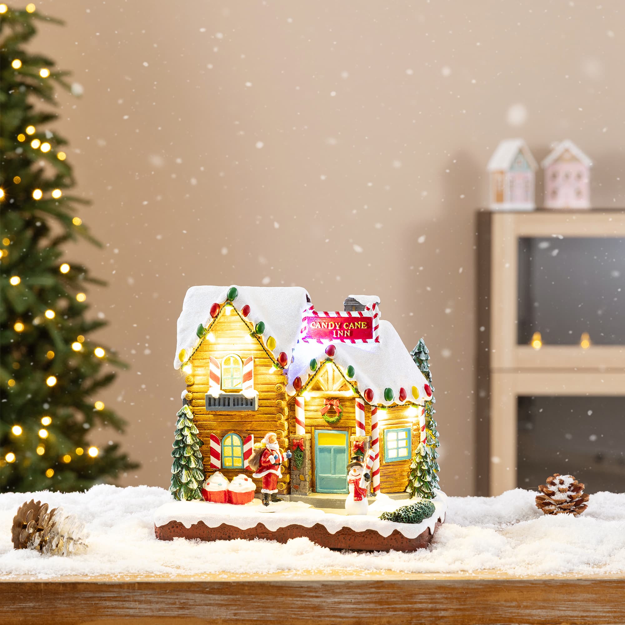 Glitzhome® 9" Lighted Christmas Candy Cane Inn Musical Resin Village with Timer