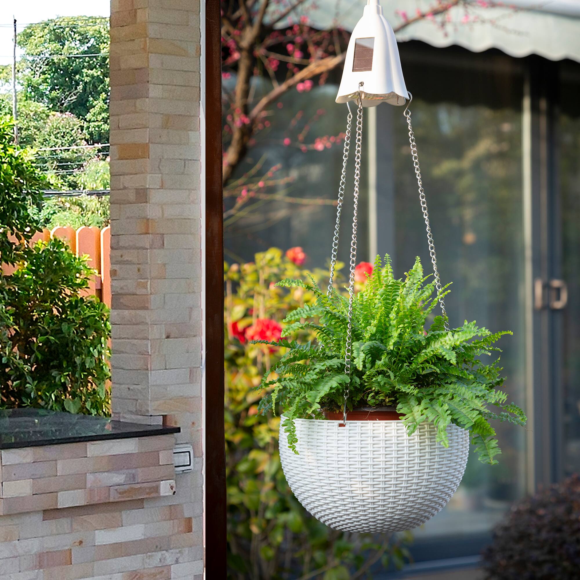 Glitzhome® 30" Solar Lighted Plastic Hanging Planter