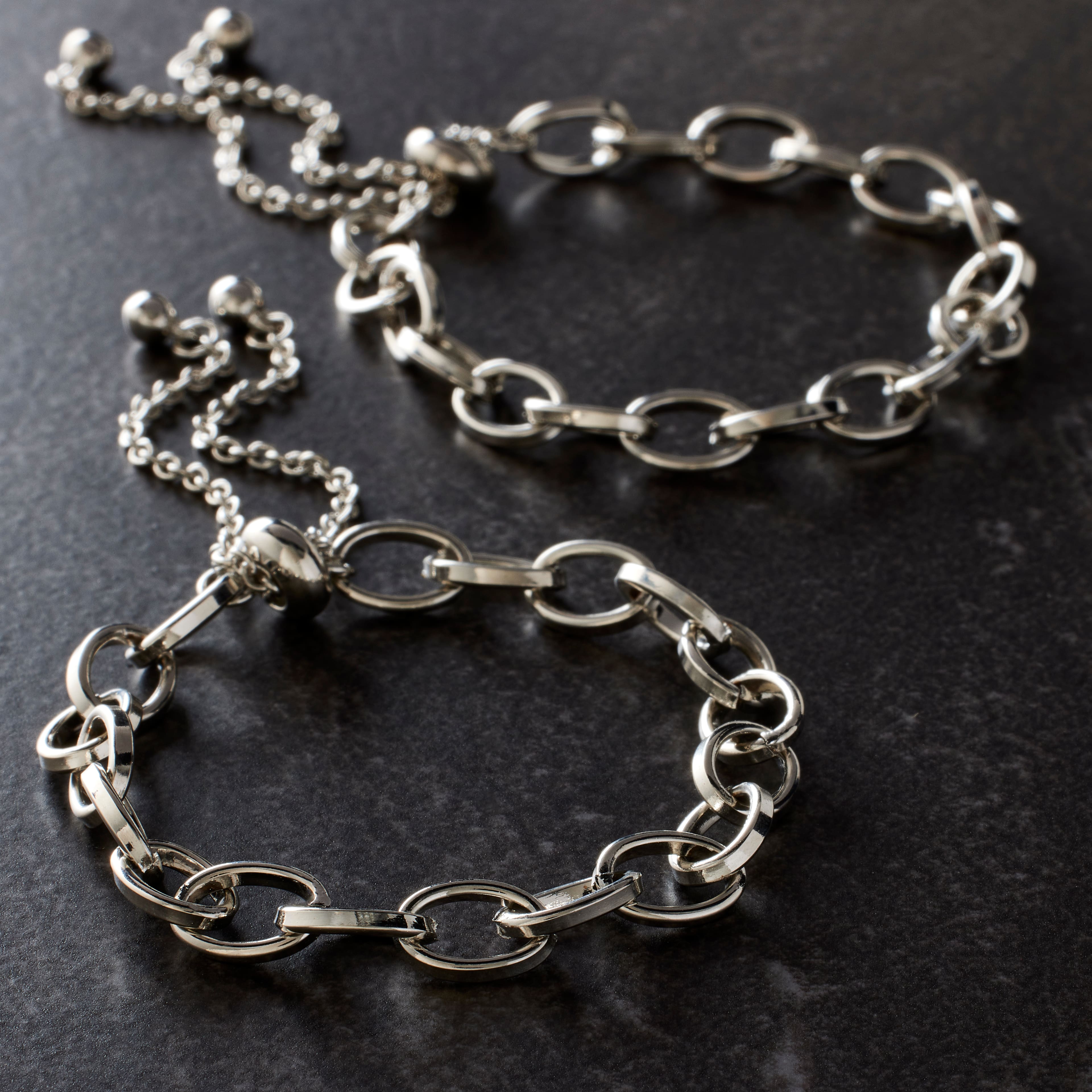 12 Packs: 2 ct. (24 total) Rhodium Cable Slider Charm Bracelets by Bead Landing™