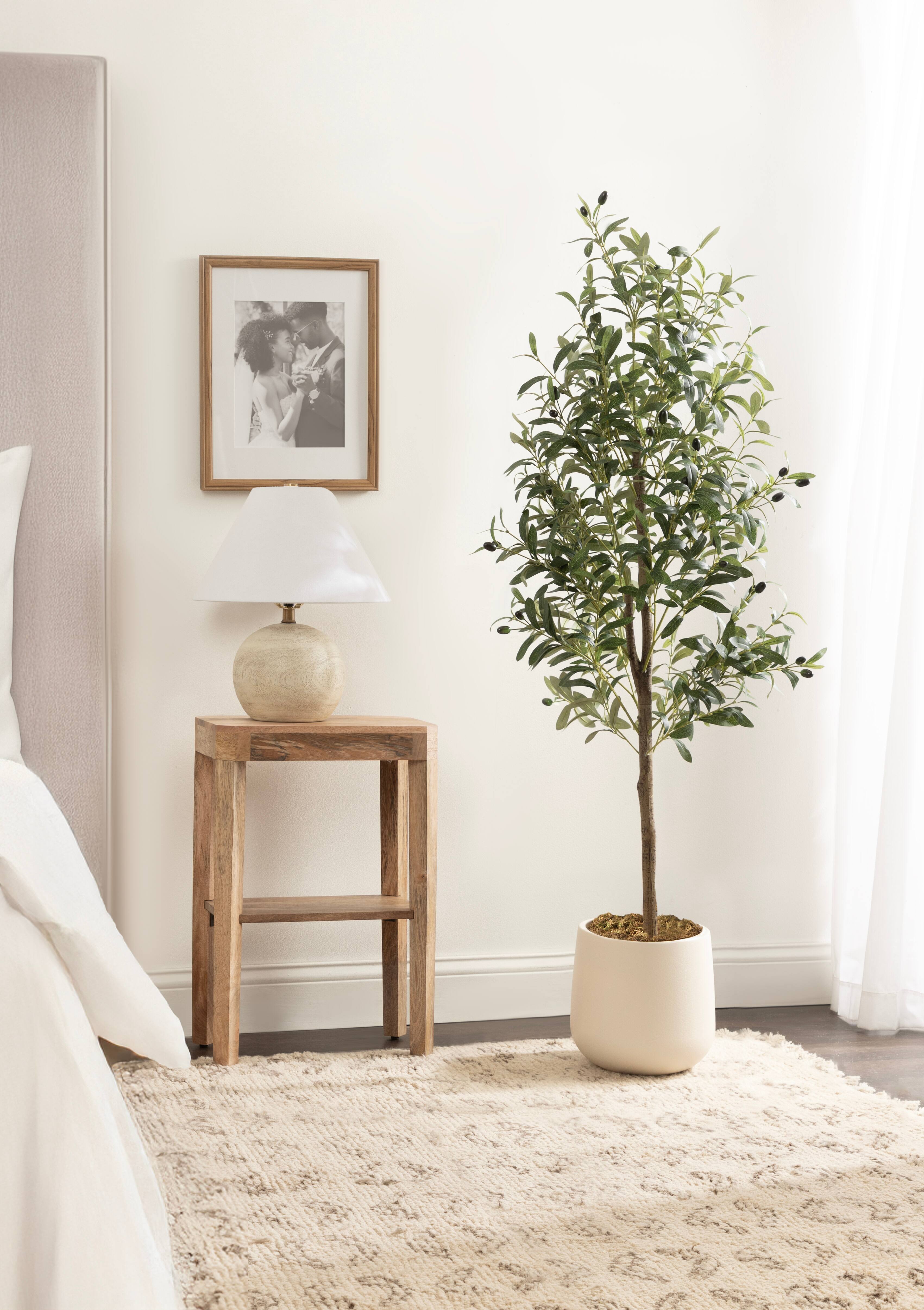 Kate and Laurel 5ft. Oliveira Faux Olive Tree with Jia Curved Cream Planter