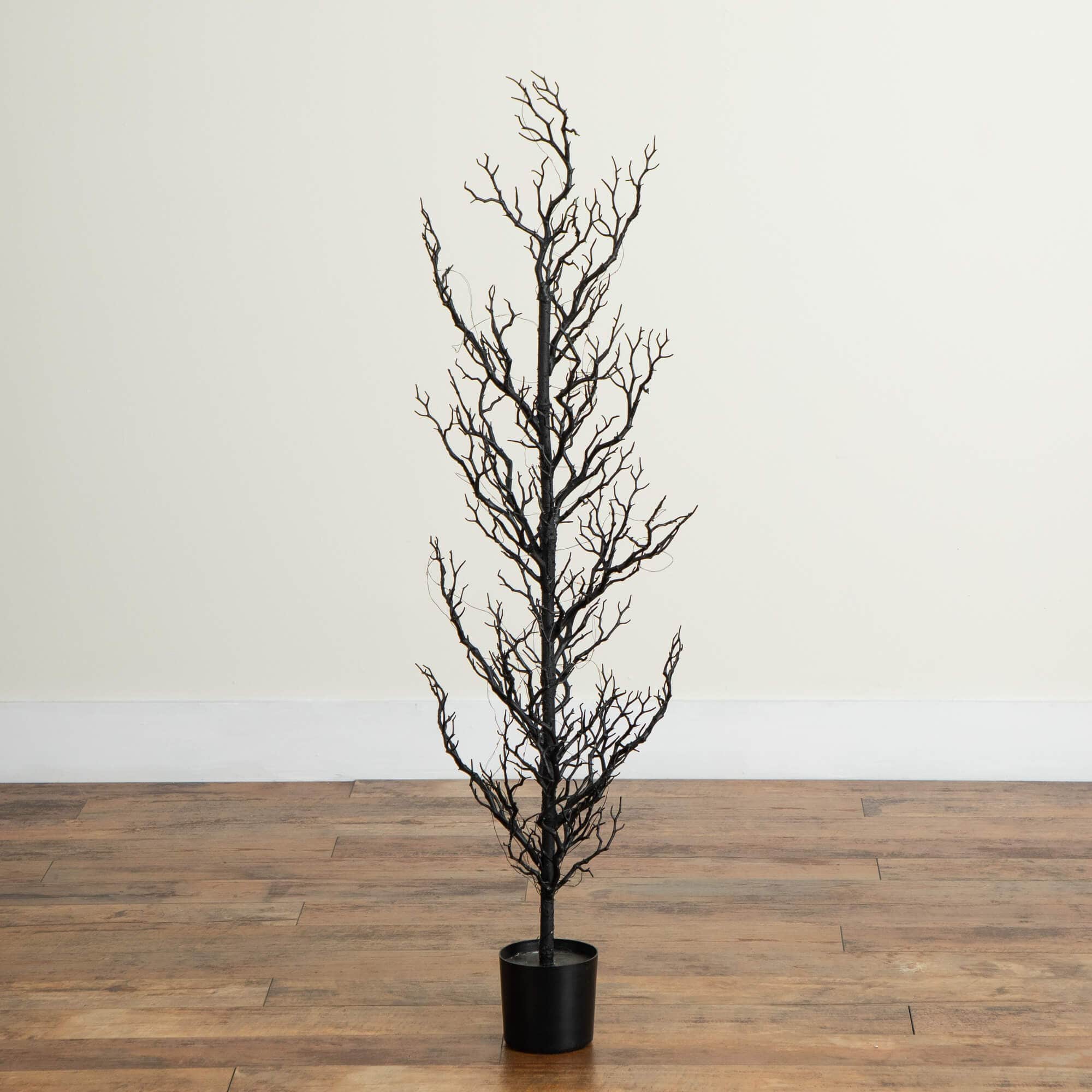 4ft. Pre-Lit Artificial Halloween Black Spooky Twig Tree with 160 Orange & Purple Copper Wire String LED Lights