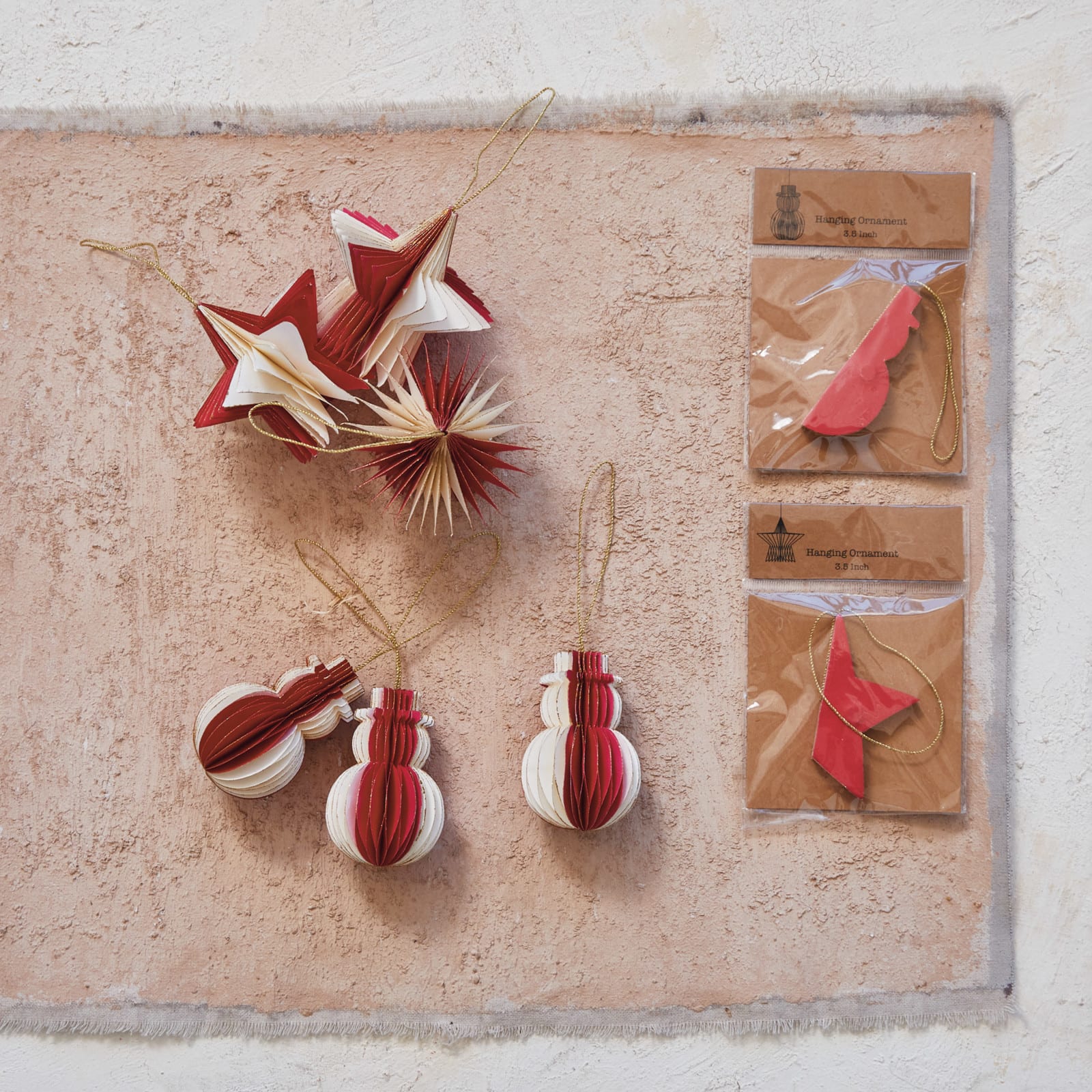 Hello Honey® 2 Pack 3.5" Red & Cream Paper Folding Honeycomb Star Ornaments with Gold Glitter Edge