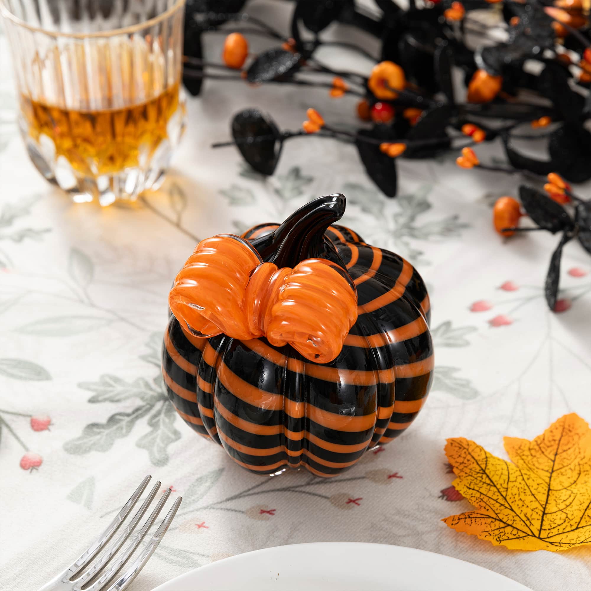Glitzhome® 4.75" Halloween Striped Glass Pumpkin with Bow