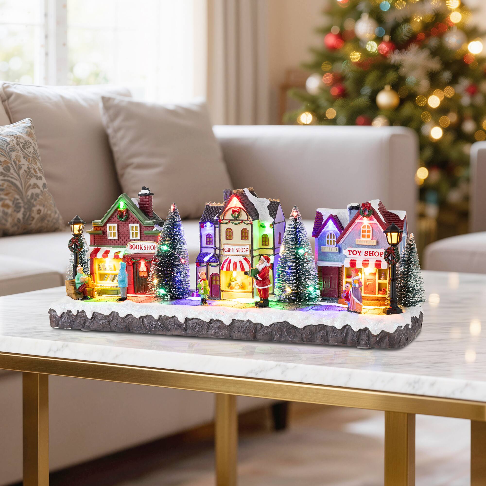 Glitzhome® 15.75" Lighted Christmas Resin Shop Avenue Musical Village with Timer