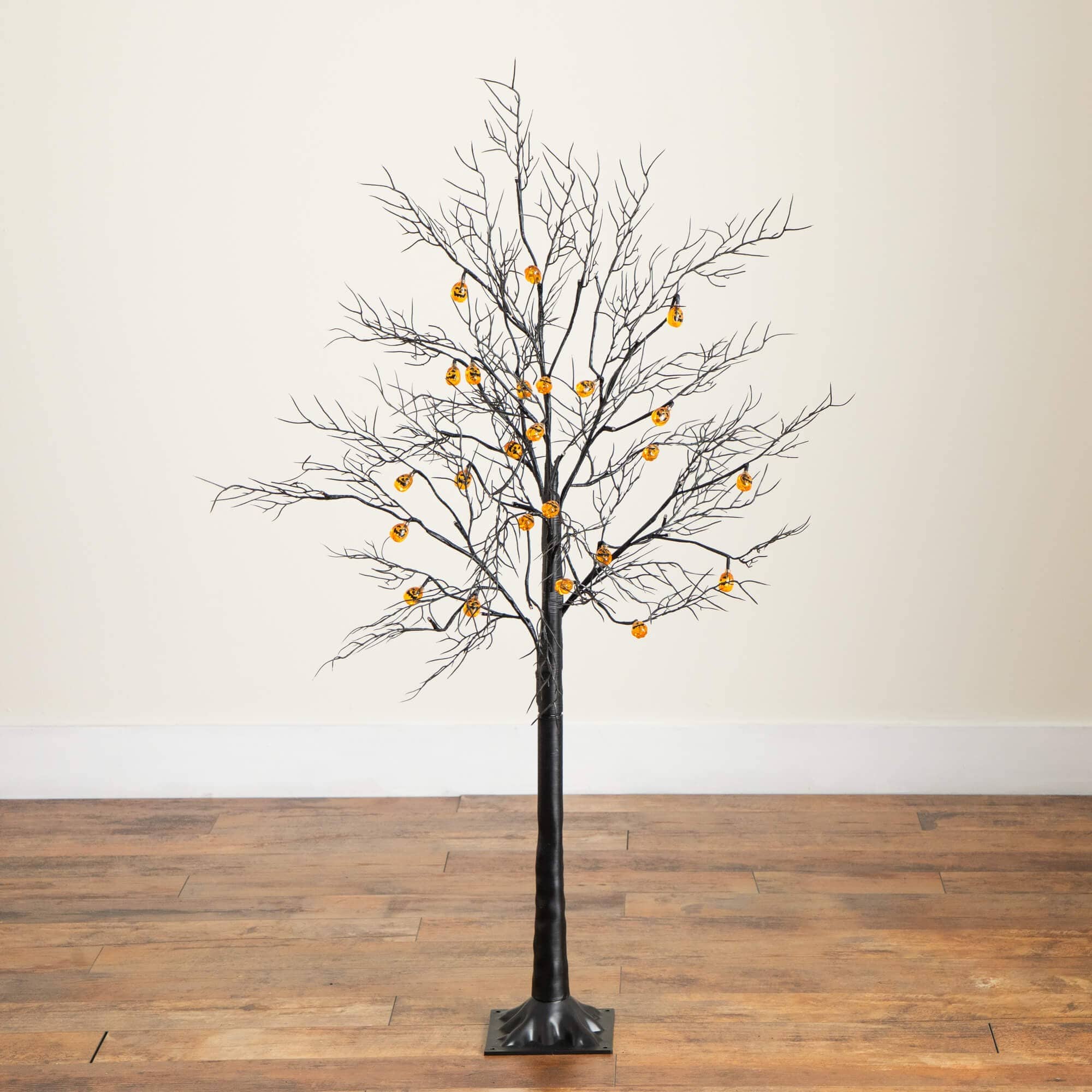 4ft. Pre-Lit Artificial Halloween Black Twig Tree with 24 Orange LED Pumpkin Shaped Lights