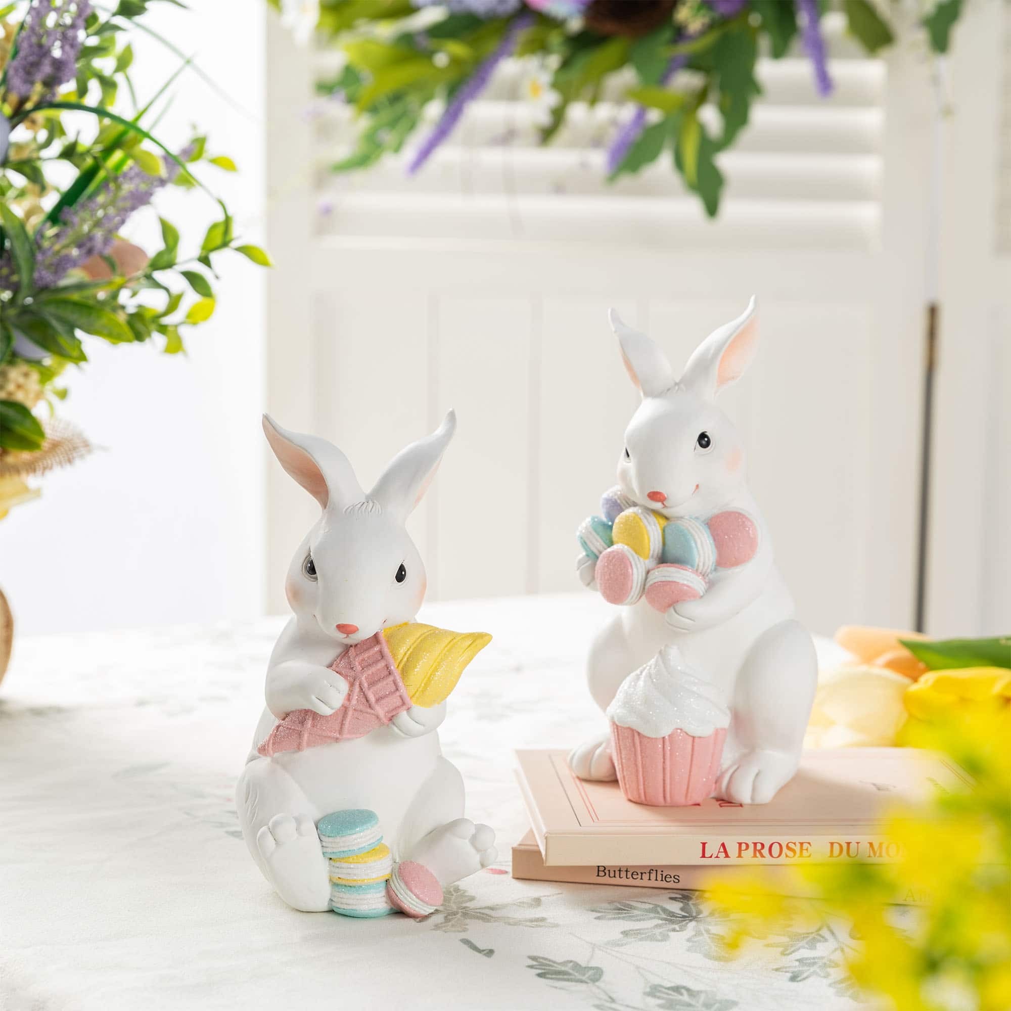 Glitzhome® Set of 2 Easter Resin Bunny Holding Macaron Table Decor