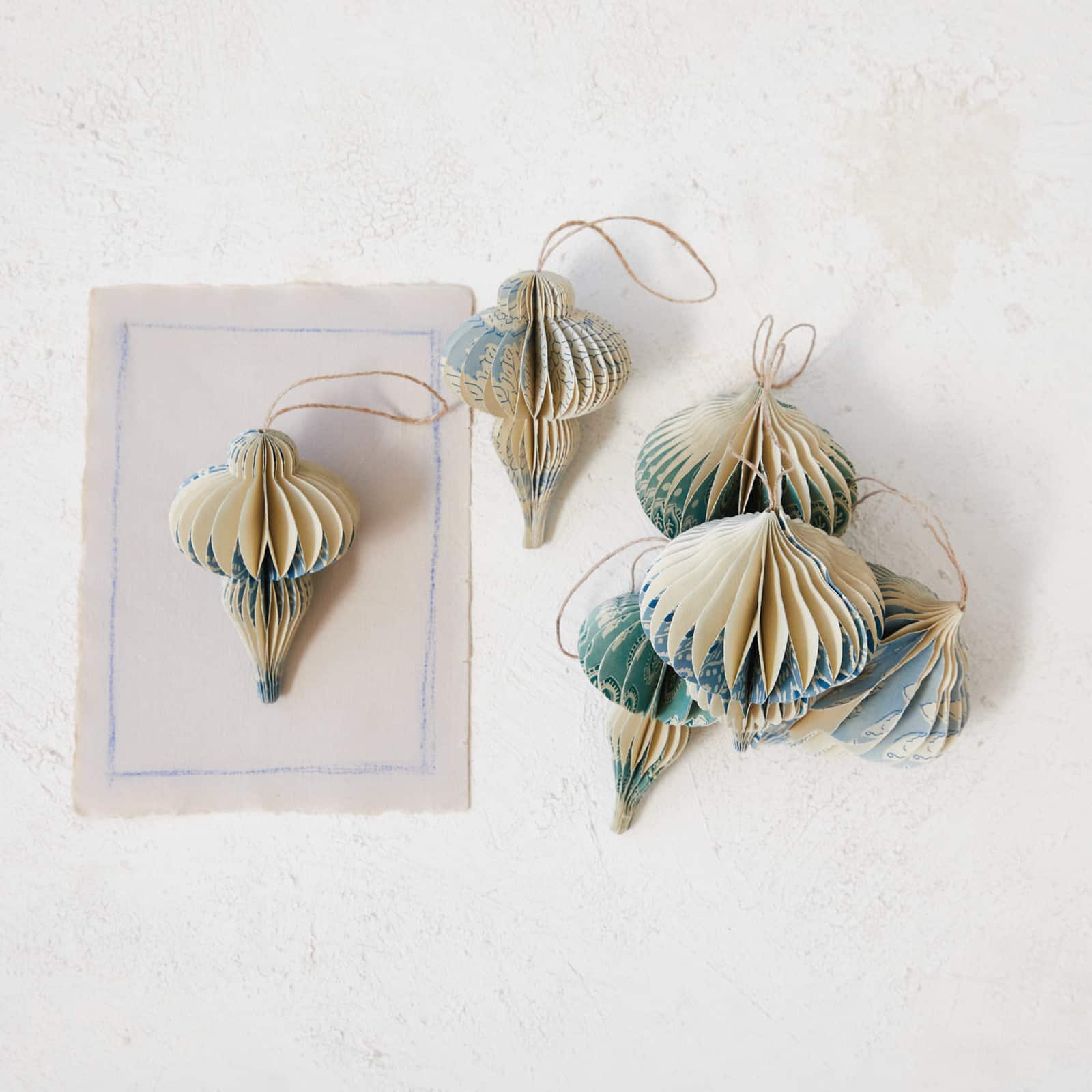 Hello Honey® 6 Pack 5" Blue & Ivory Honeycomb Finial Recycled Paper Ornaments