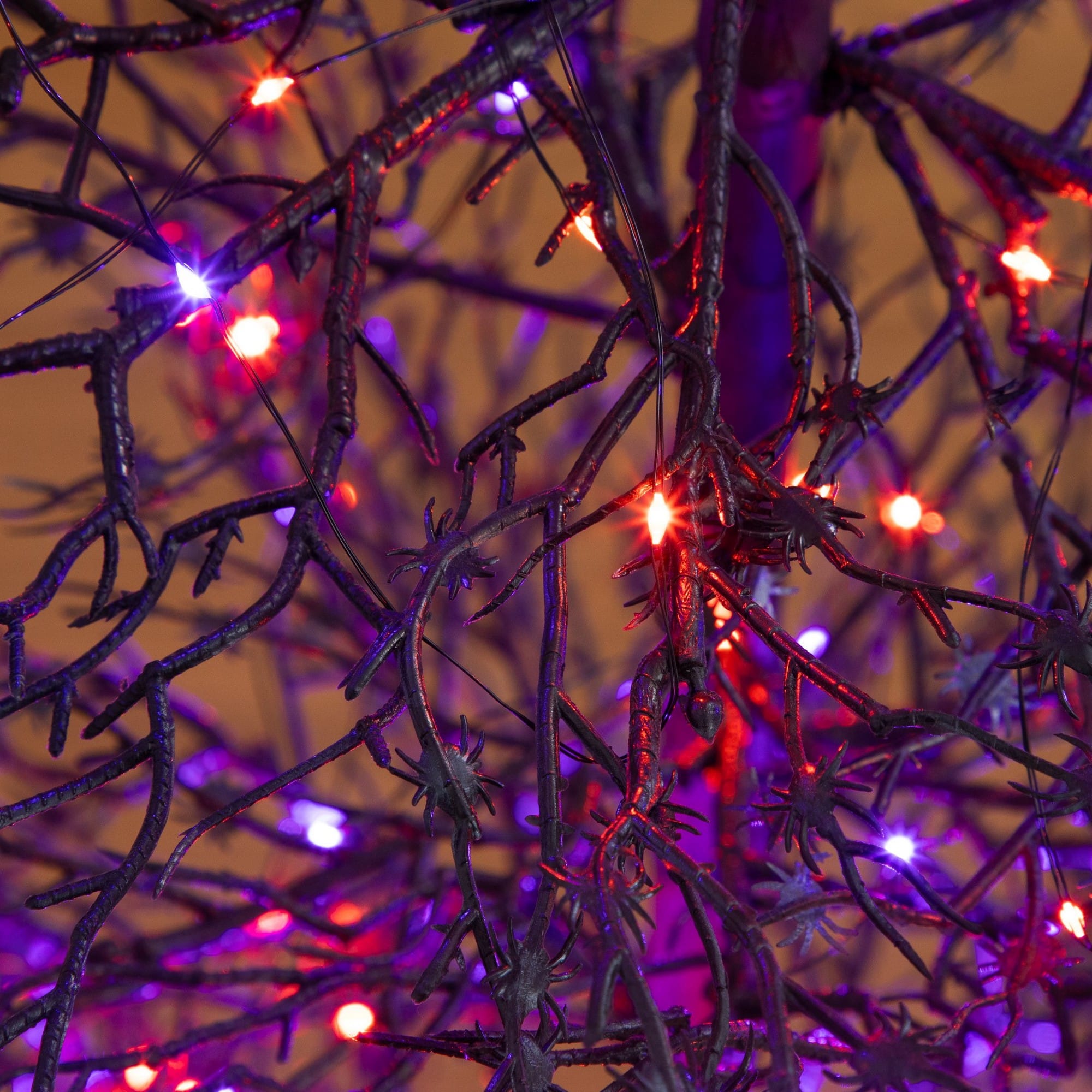 4ft. Pre-Lit Artificial Halloween Spider Twig Tree with 100 Orange & Purple LED Lights