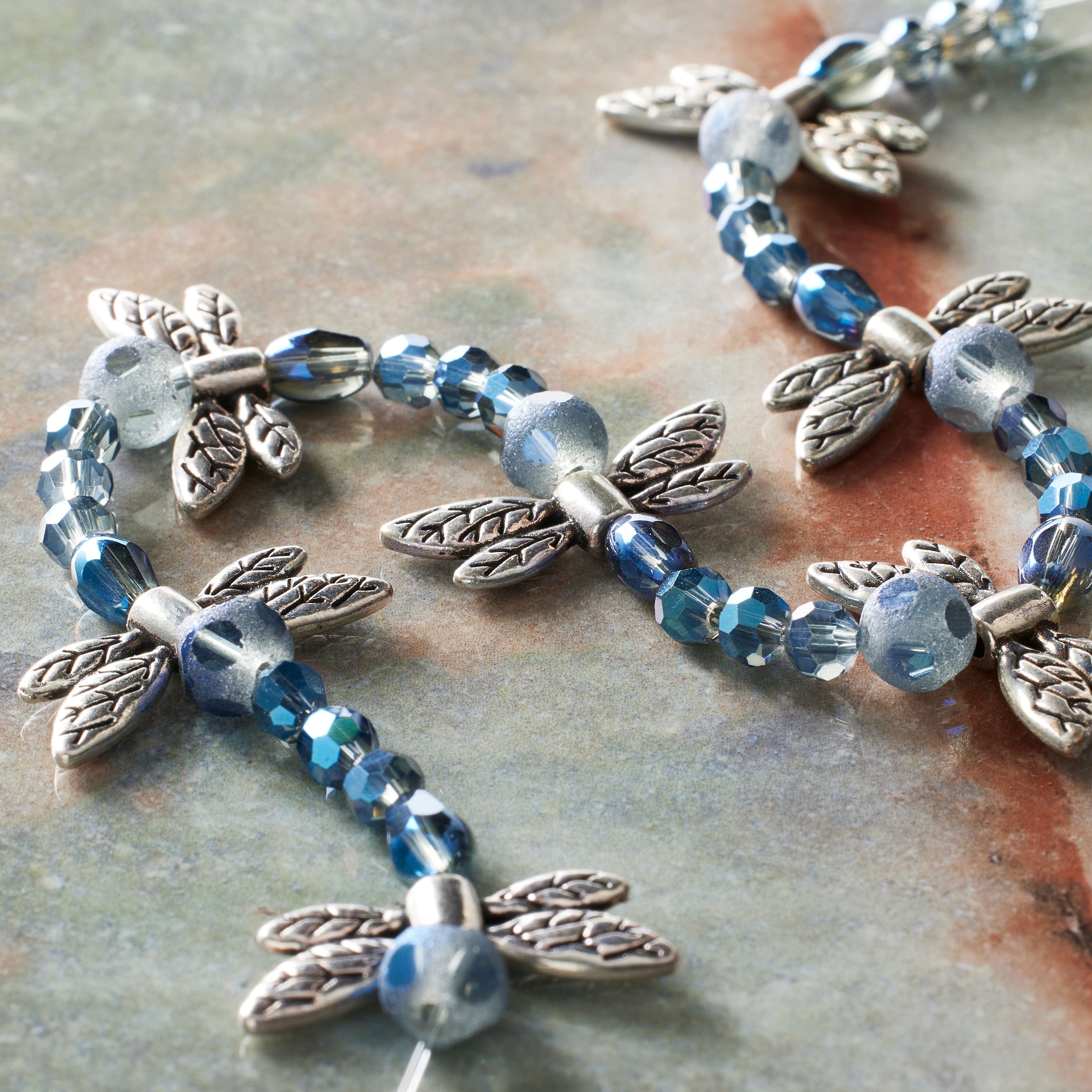 12 Packs: 42 ct. (504 total) Silver & Blue Dragonfly Mix Beads by Bead Landing™