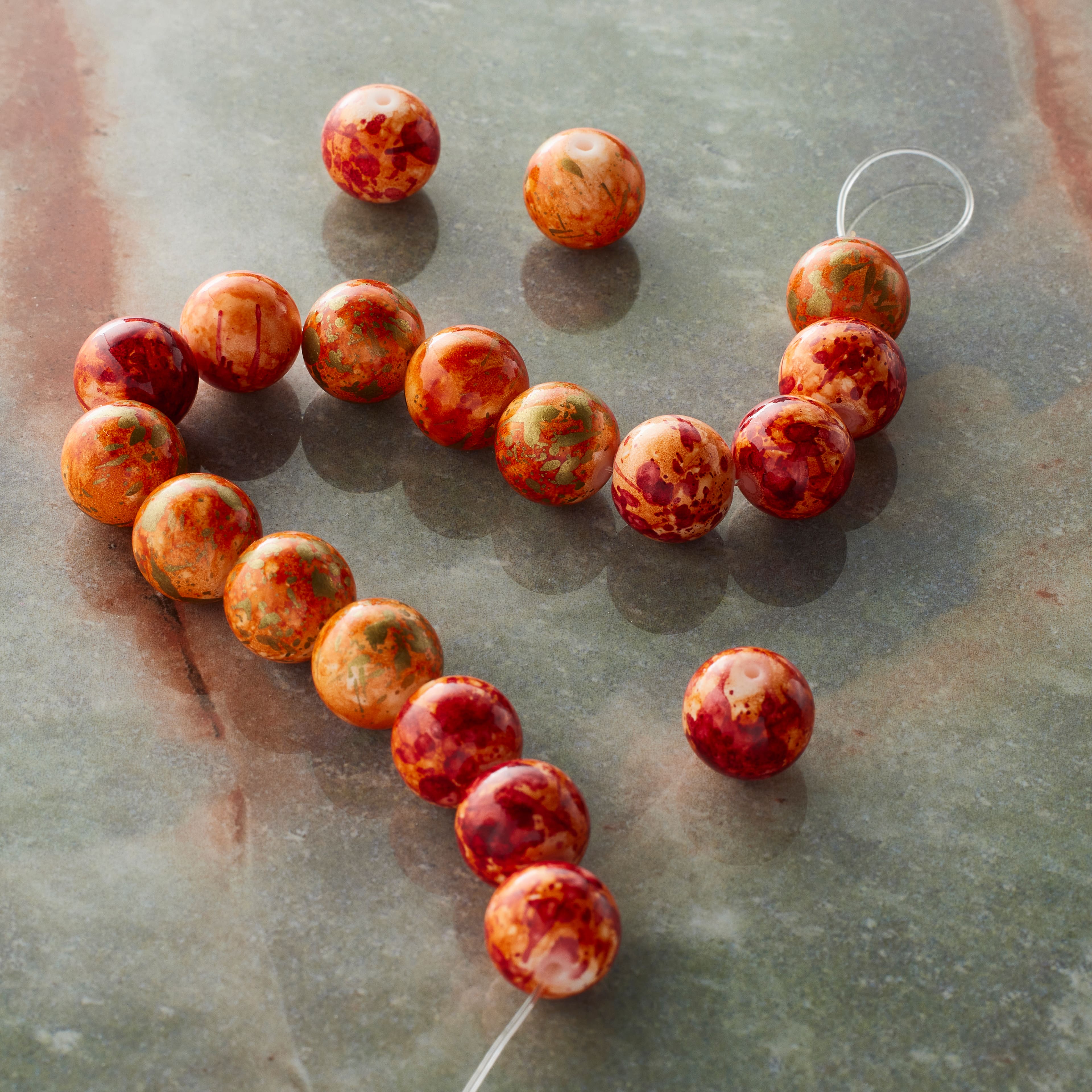 12 Pack: Orange Swirl Ceramic Round Beads, 10mm by Bead Landing™