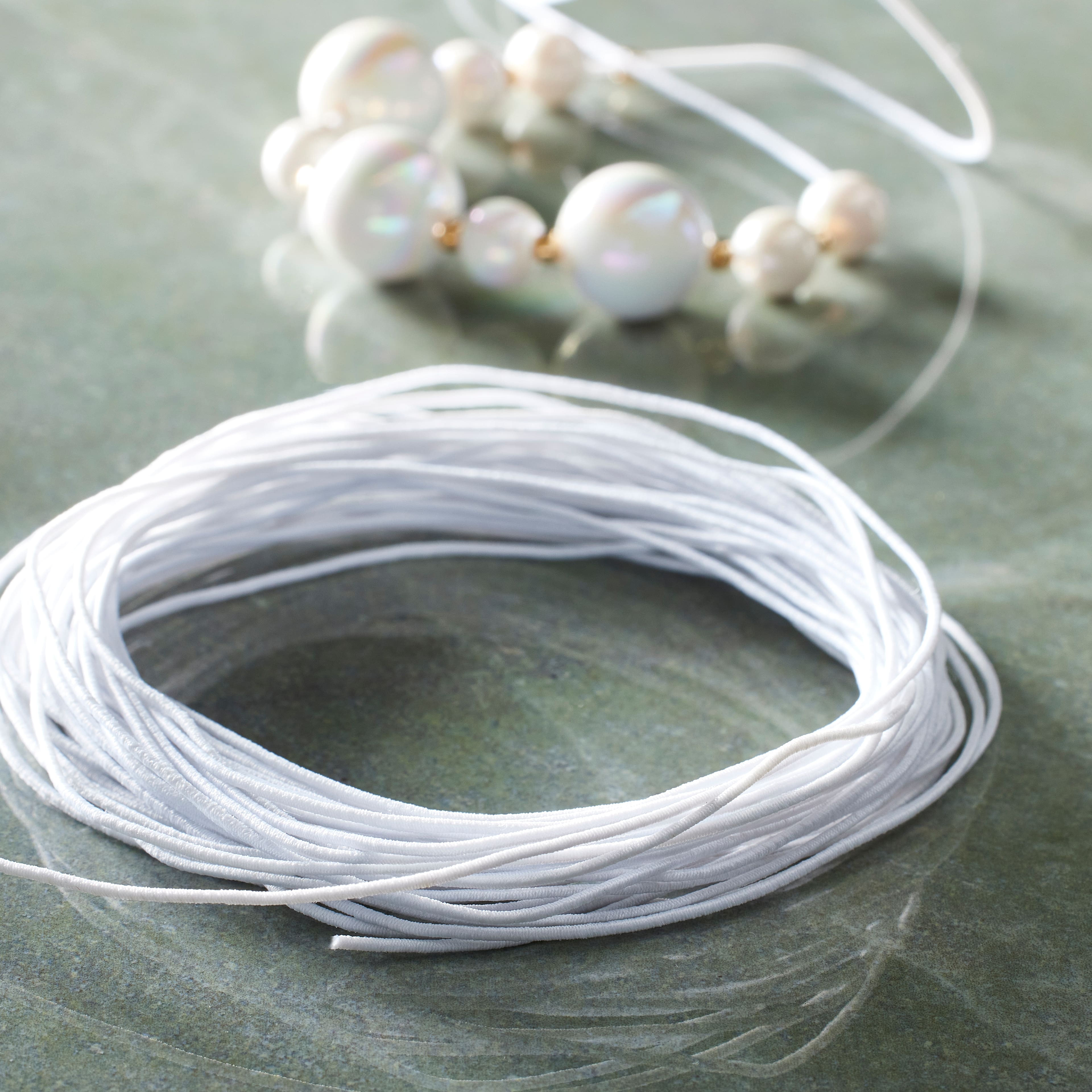 12 Pack: 0.5mm White Elastic Cord by Bead Landing™
