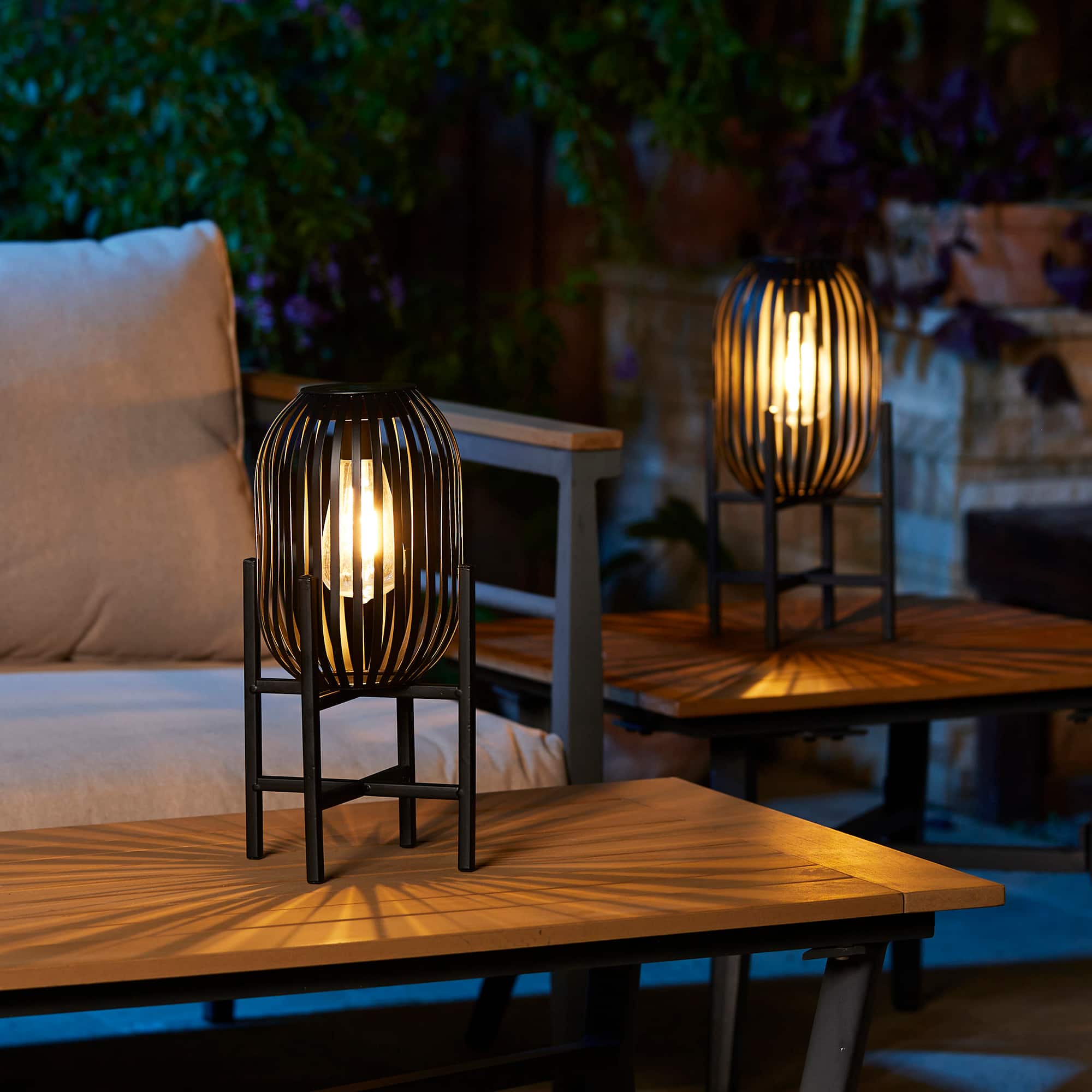 Glitzhome® 14.25" Black Slim Metal Stripes Solar Powered Edison Bulb Outdoor Lantern, 2ct.