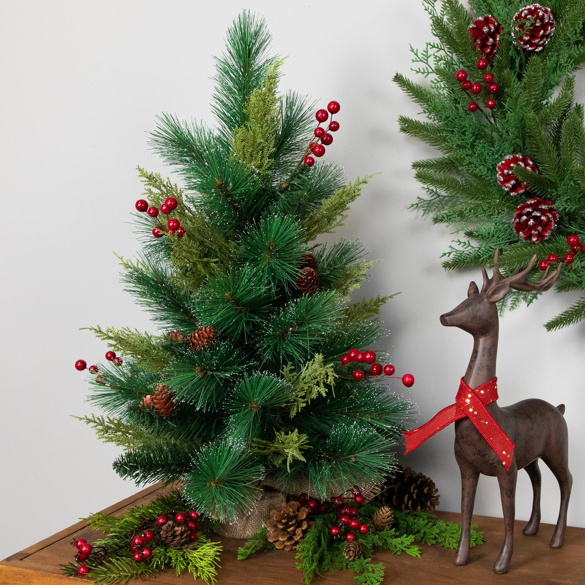 25" Unlit Spruce Pine Needle Artificial Christmas Tree in Burlap Base