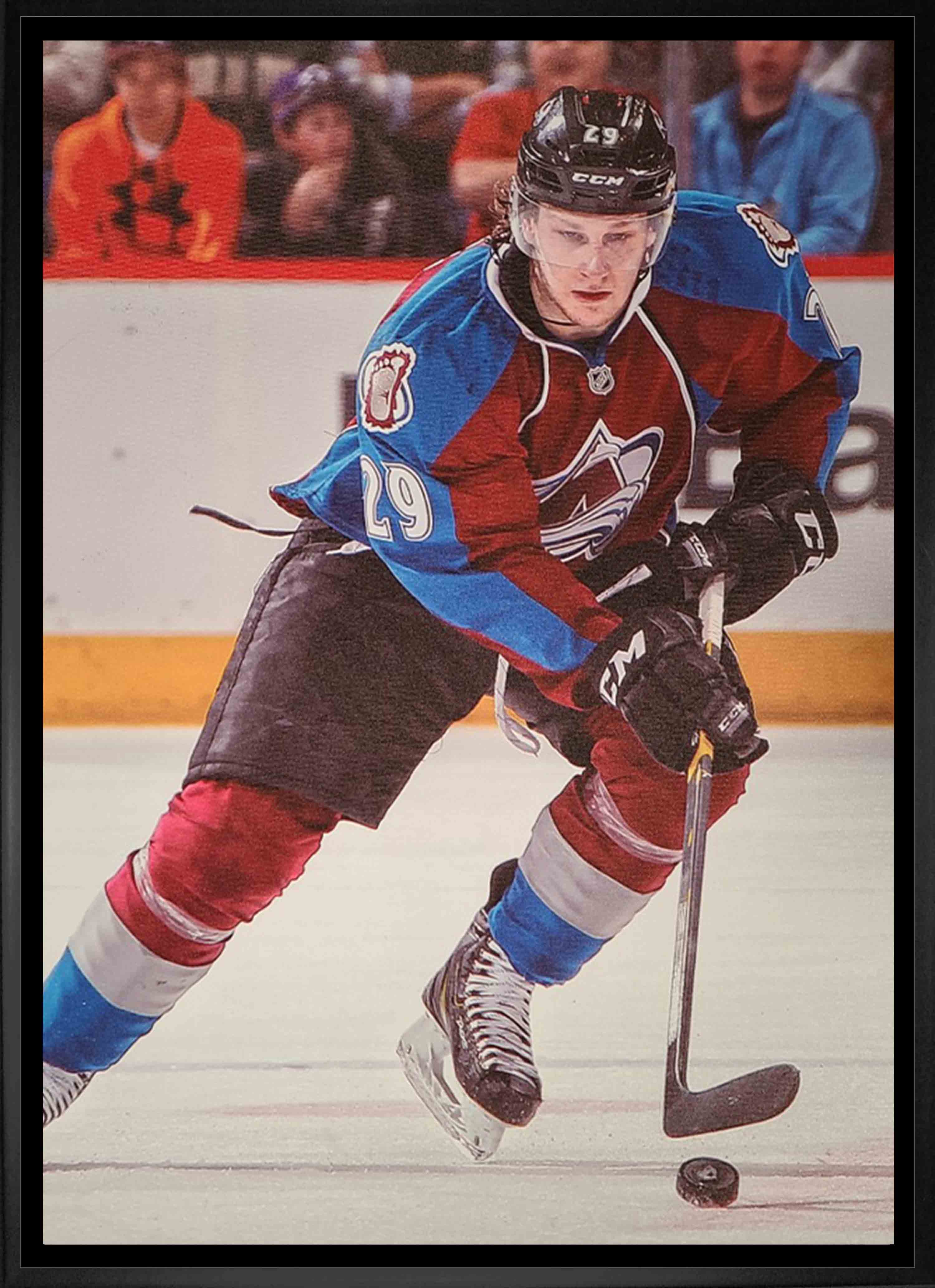 Nathan MacKinnon Colorado Avalanche Framed 20" x 29" Skating with Puck Canvas 22.5" x 31.5"