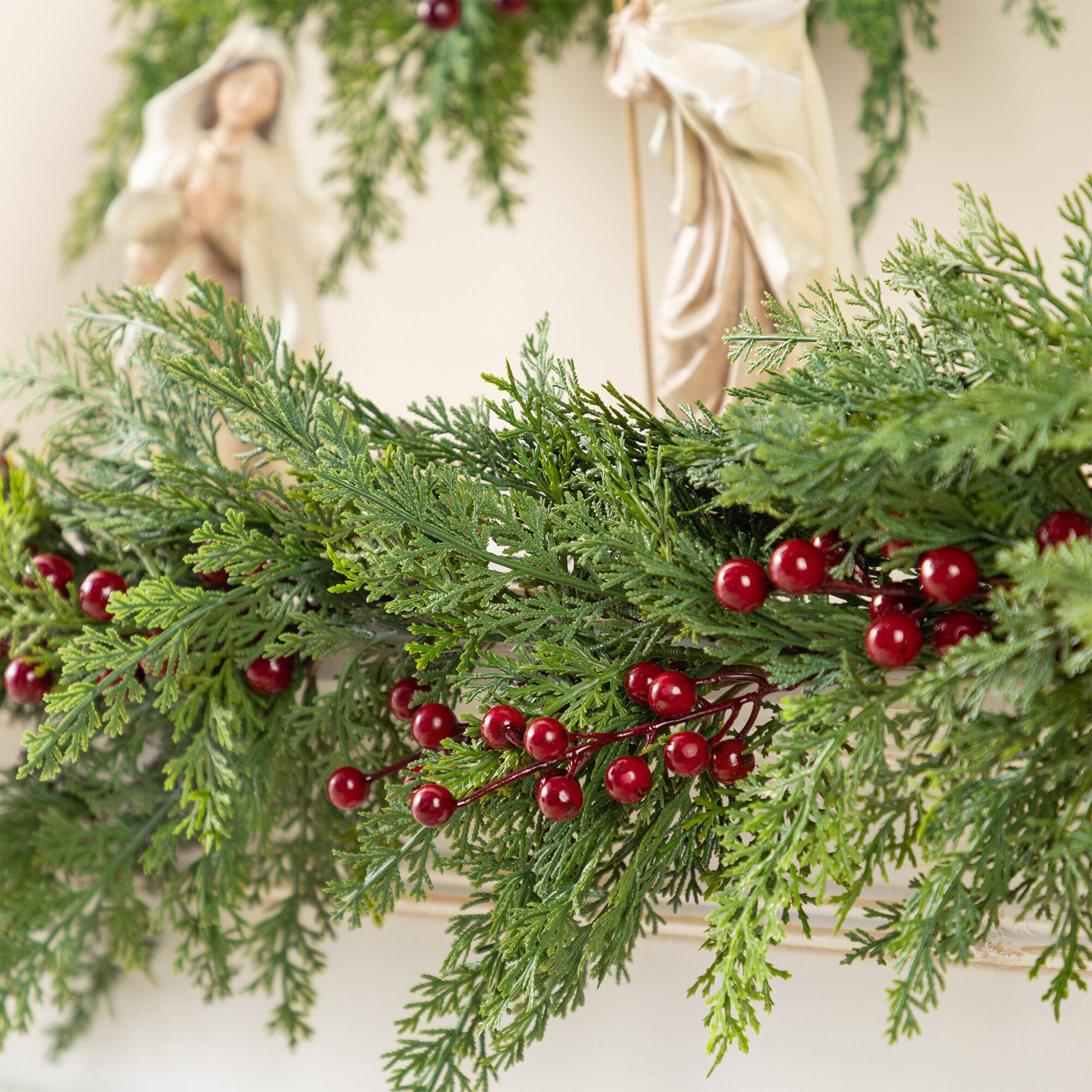 Glitzhome® 9ft. Christmas Greenery PE Dripping Cedar Garland with Red Berries, Set of 2