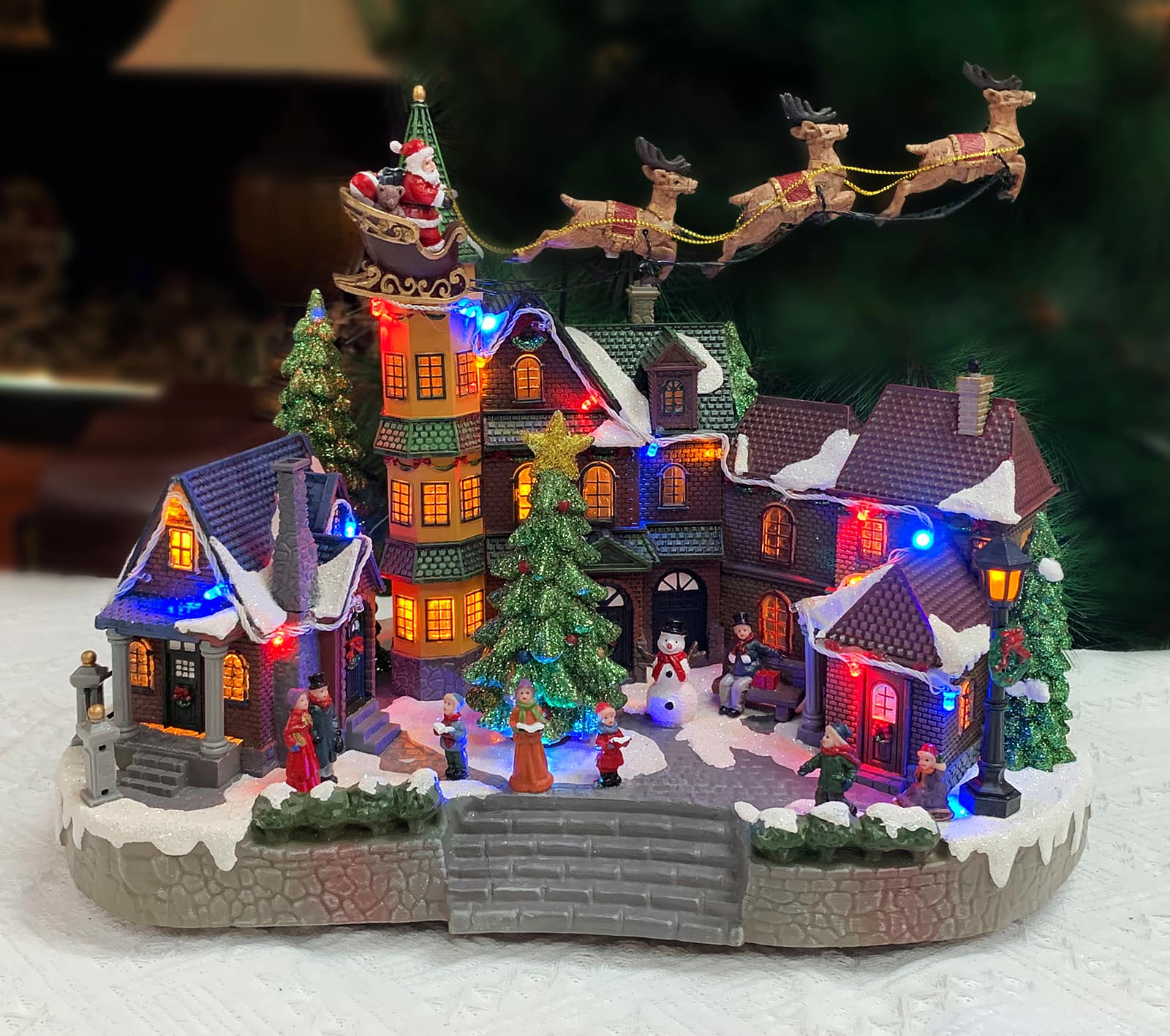 Moments in Time 12.8" Animated Santa Riding Sleigh Flying Over Town Center Décor