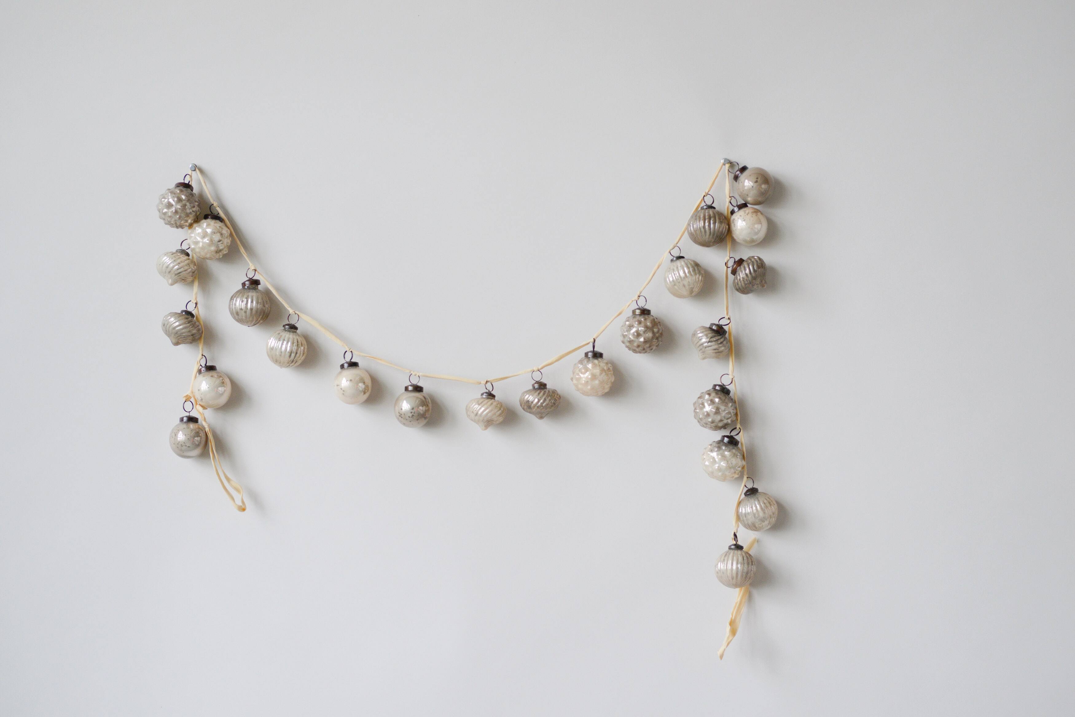 Hello Honey® 6ft. Silver & White Embossed Mercury Glass Ornament Garland