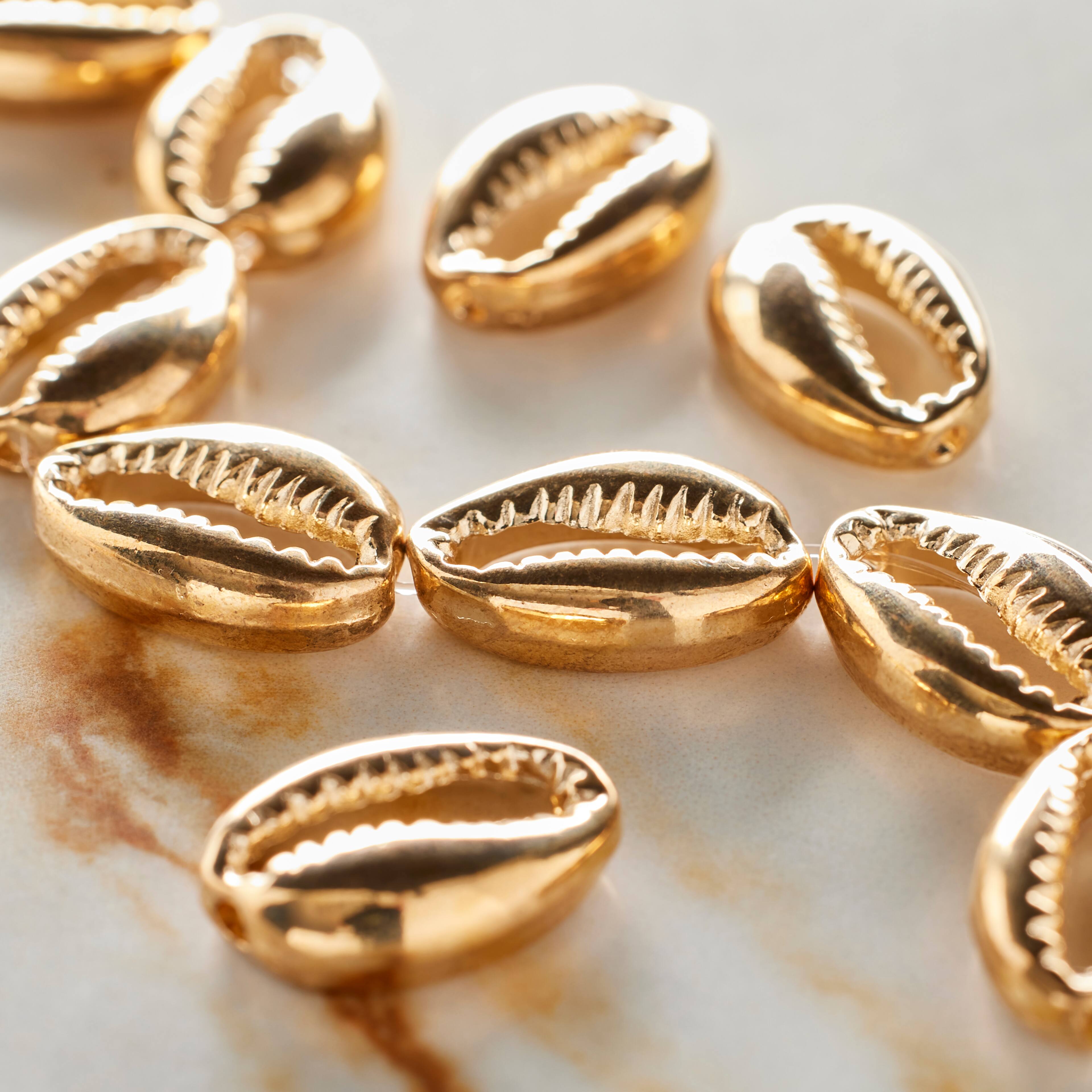12 Packs: 11 ct. (132 total) Gold Cowrie Shell Beads, 17mm by Bead Landing®
