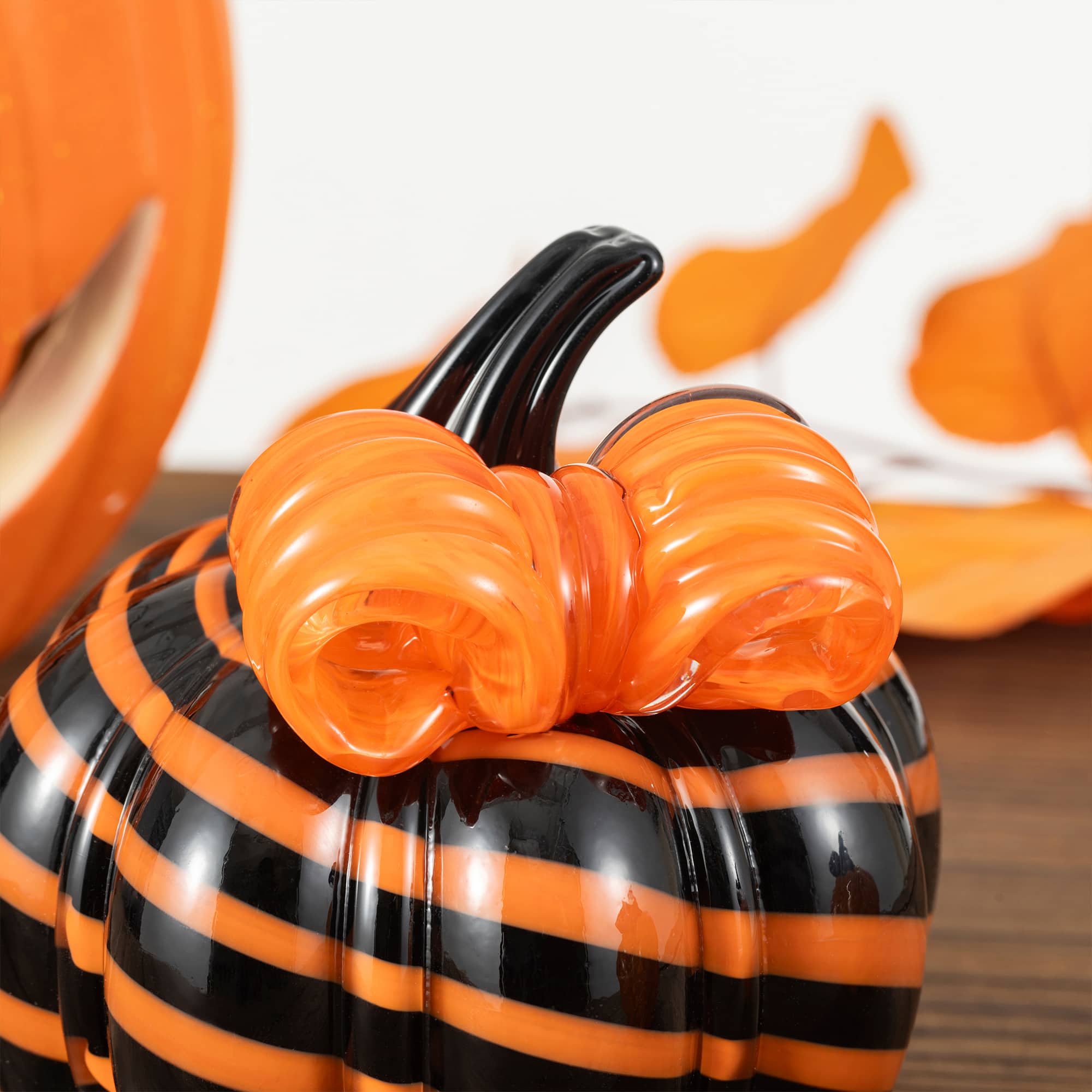 Glitzhome® 4.75" Halloween Striped Glass Pumpkin with Bow