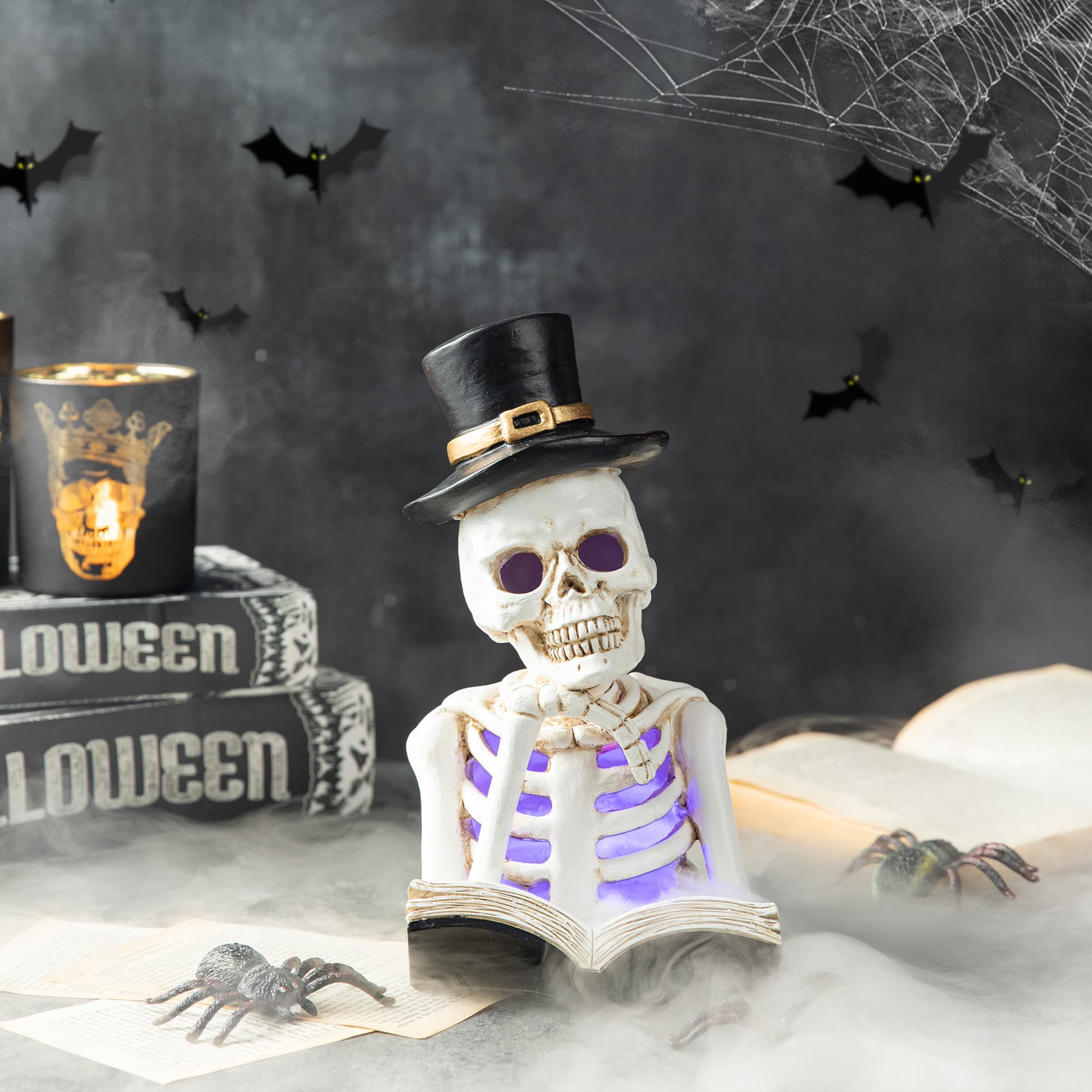 Glitzhome® 10" Lighted Halloween Resin Skull Reading Book Table Décor
