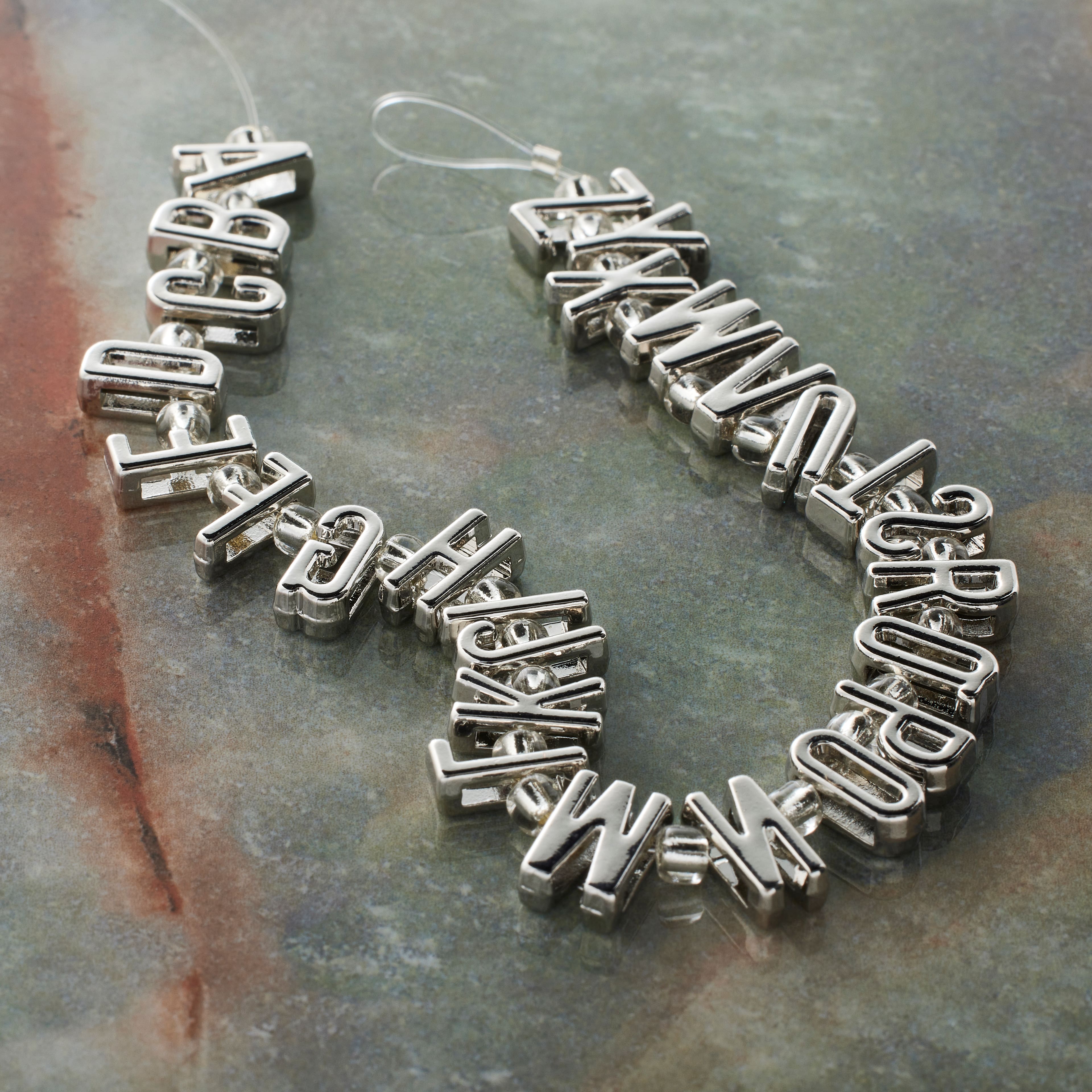 12 Packs: 26 ct. (312 total) Rhodium Alphabet Metal Beads by Bead Landing™