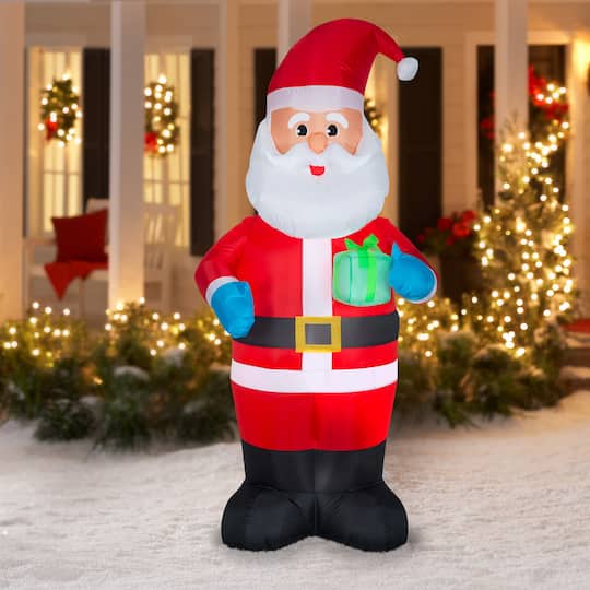 7ft. Airblown® Inflatable Santa with Present | Michaels