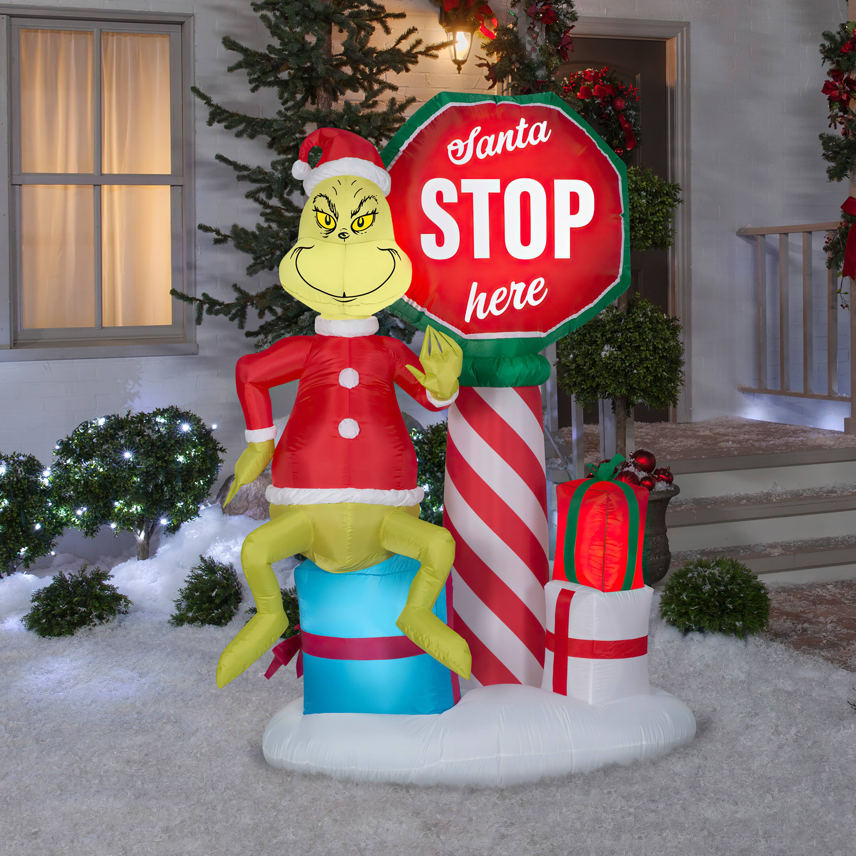 6ft. Airblown&#xAE; Inflatable Grinch with Santa Stop Here Sign