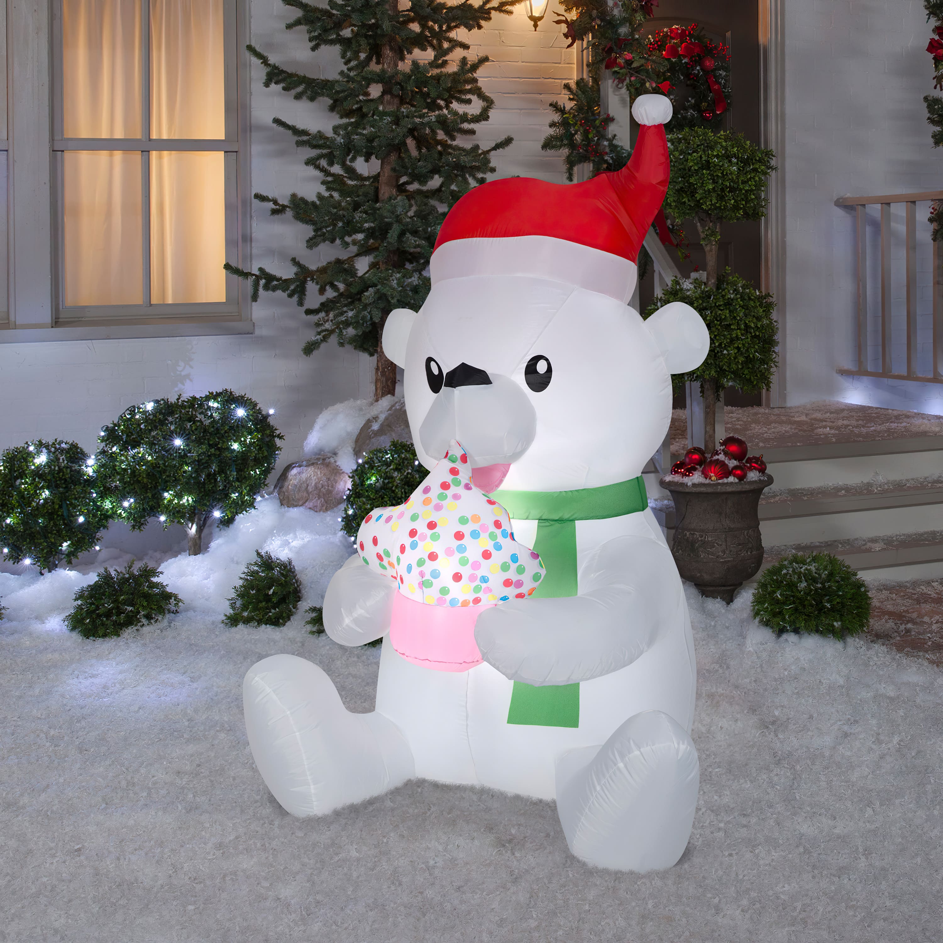 5.5ft. Animated Airblown&#xAE; Inflatable Nom Nom Polar Bear with Cupcake
