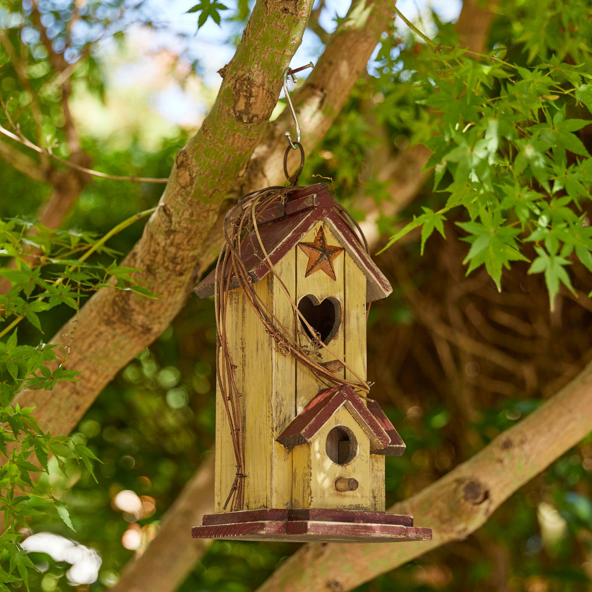 Glitzhome&#xAE; 11.5&#x22; Yellow Washed with Rattan Distressed Wood Cottage Birdhouse