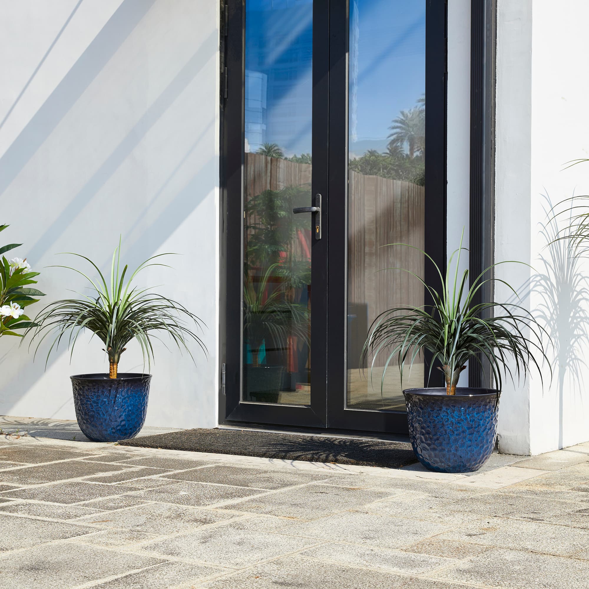 Glitzhome® 15.25" Honeycomb Textured Cobalt Blue Faux Ceramic Plastic Planters, 2ct.