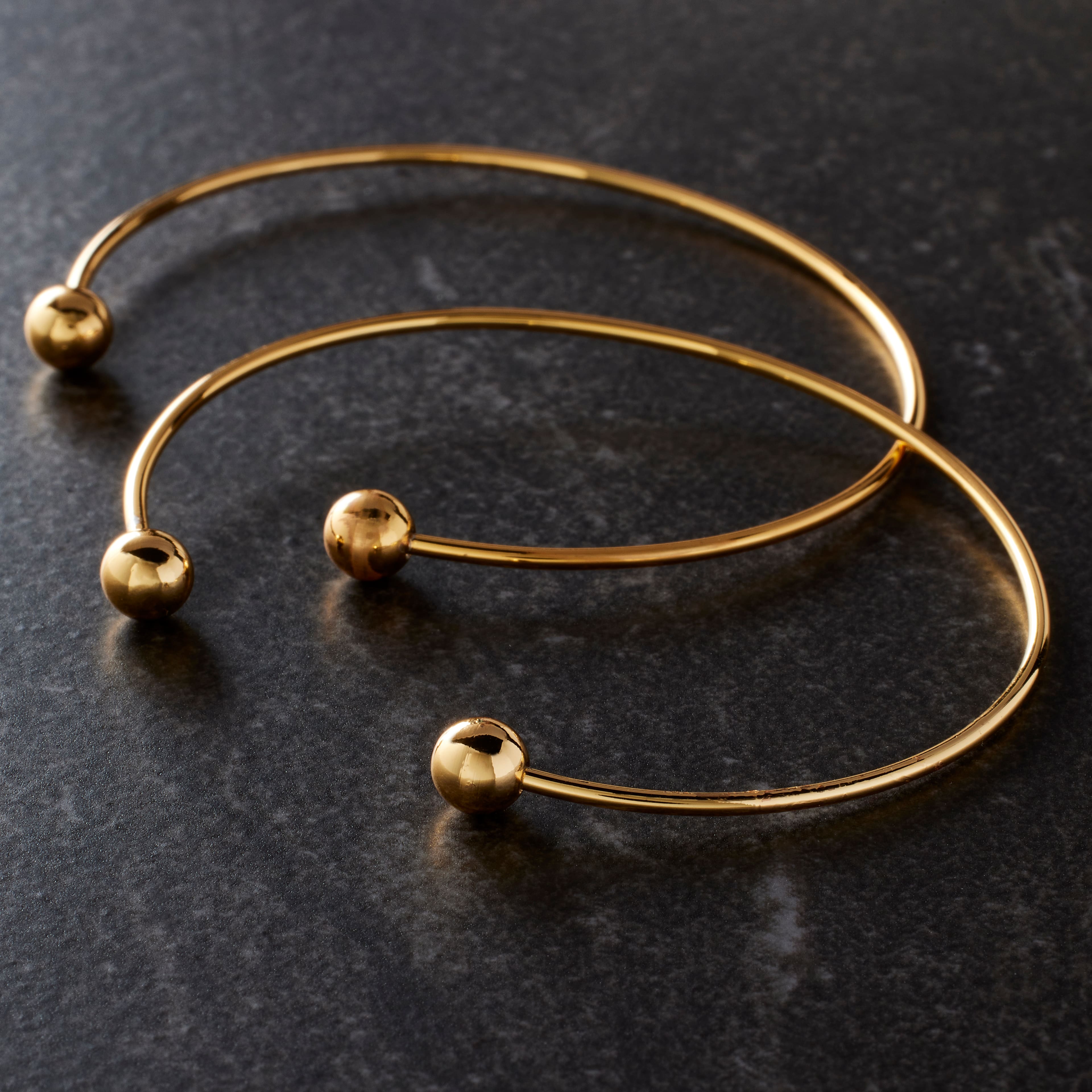 12 Packs: 2 ct. (24 total) 65mm Gold Charm Bangles by Bead Landing&#x2122;