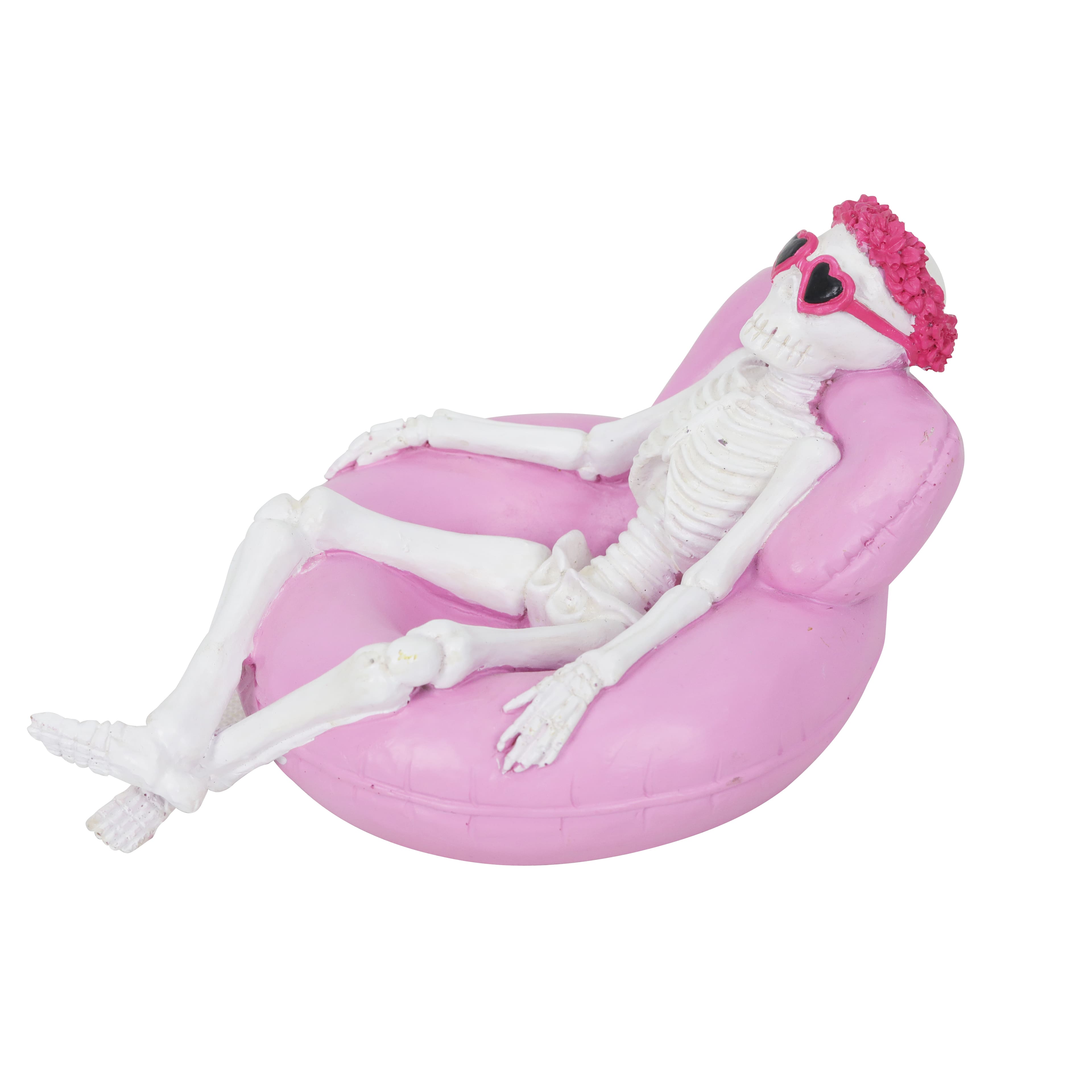 7.25&#x22; Skeleton on a Pink Pool Float Tabletop D&#xE9;cor by Ashland&#xAE;