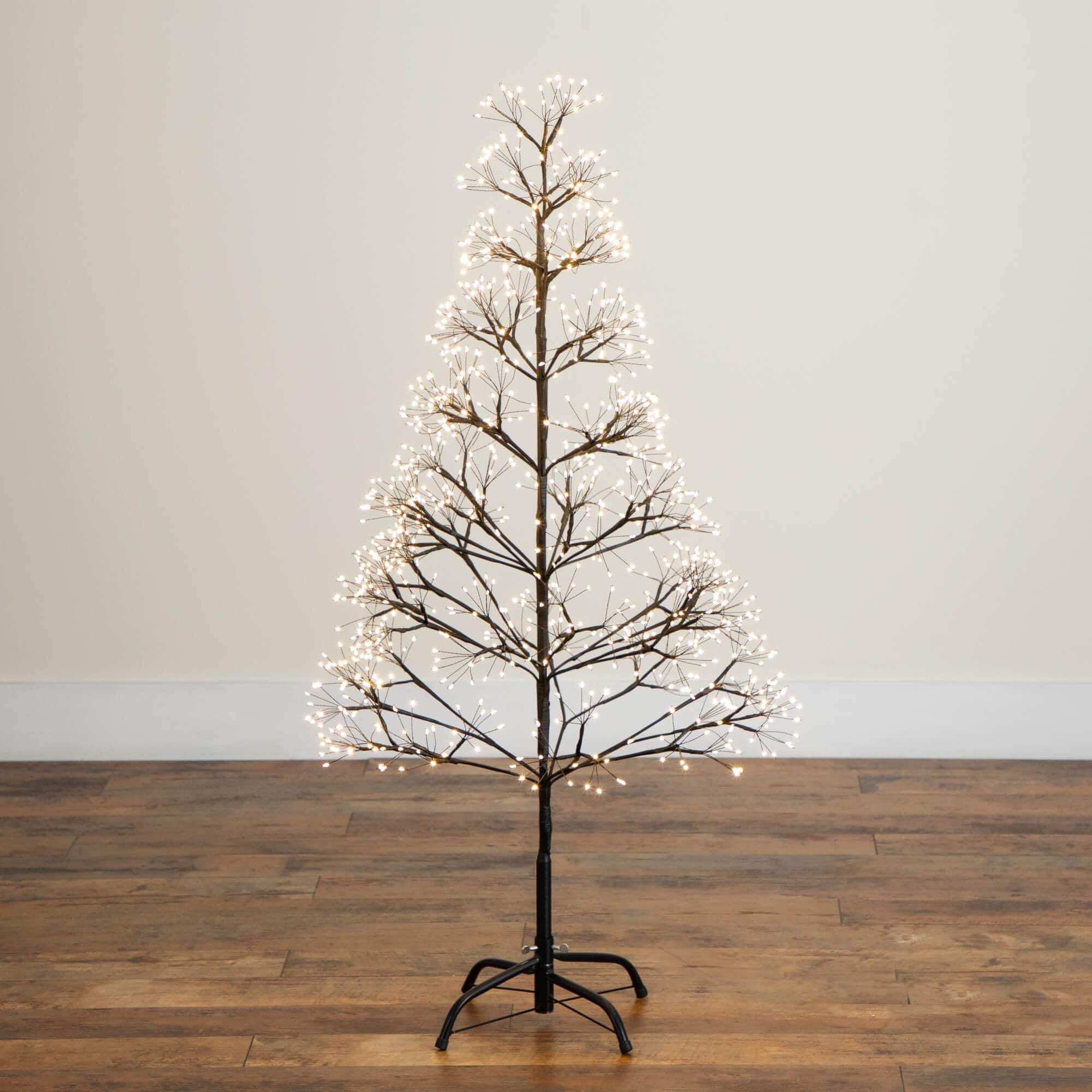 4ft. Pre-Lit Artificial Halloween Black Starburst Tree with 800 Fairy Warm White LED Lights
