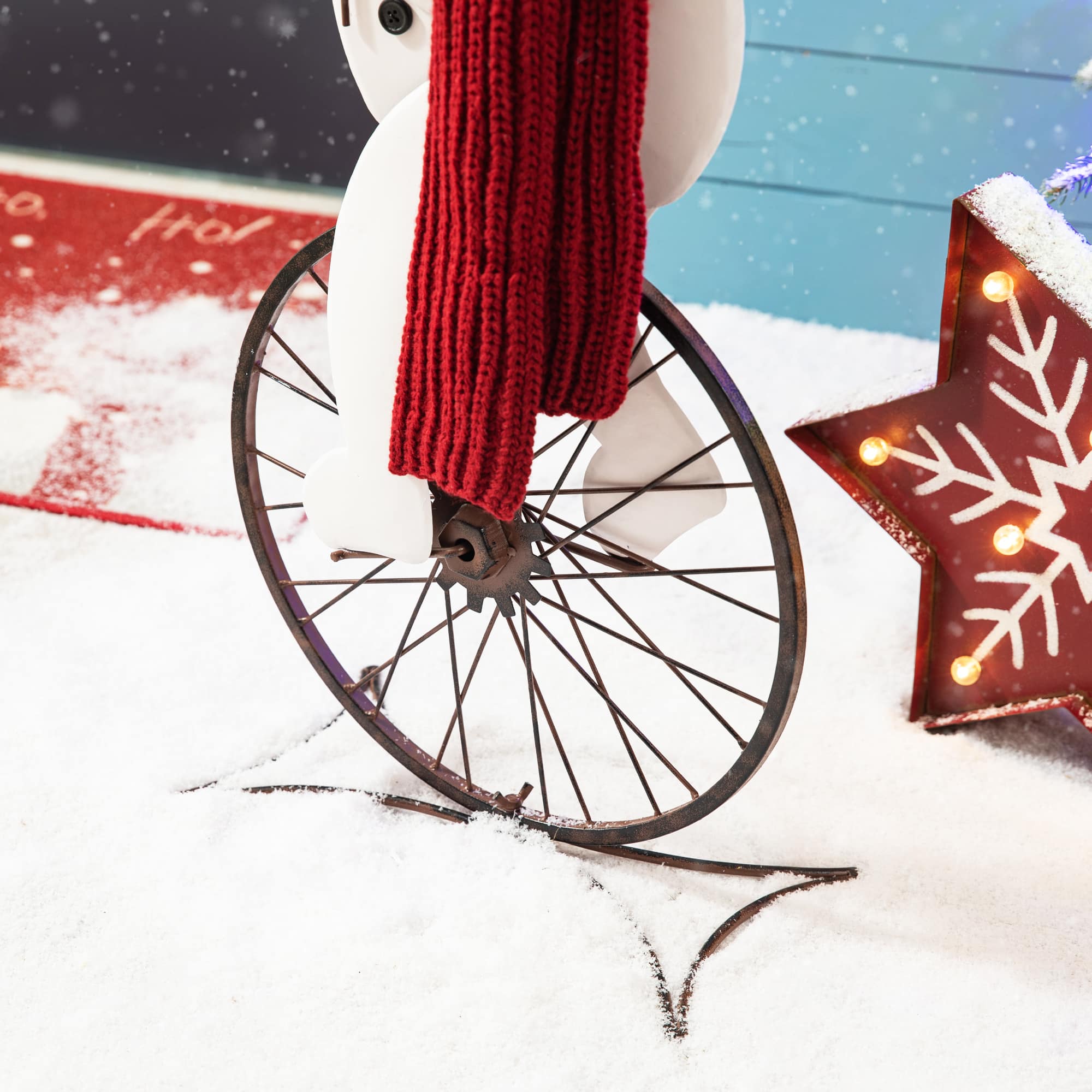 Glitzhome&#xAE; 32&#x22; Metal Snowman Riding Bike Porch D&#xE9;cor