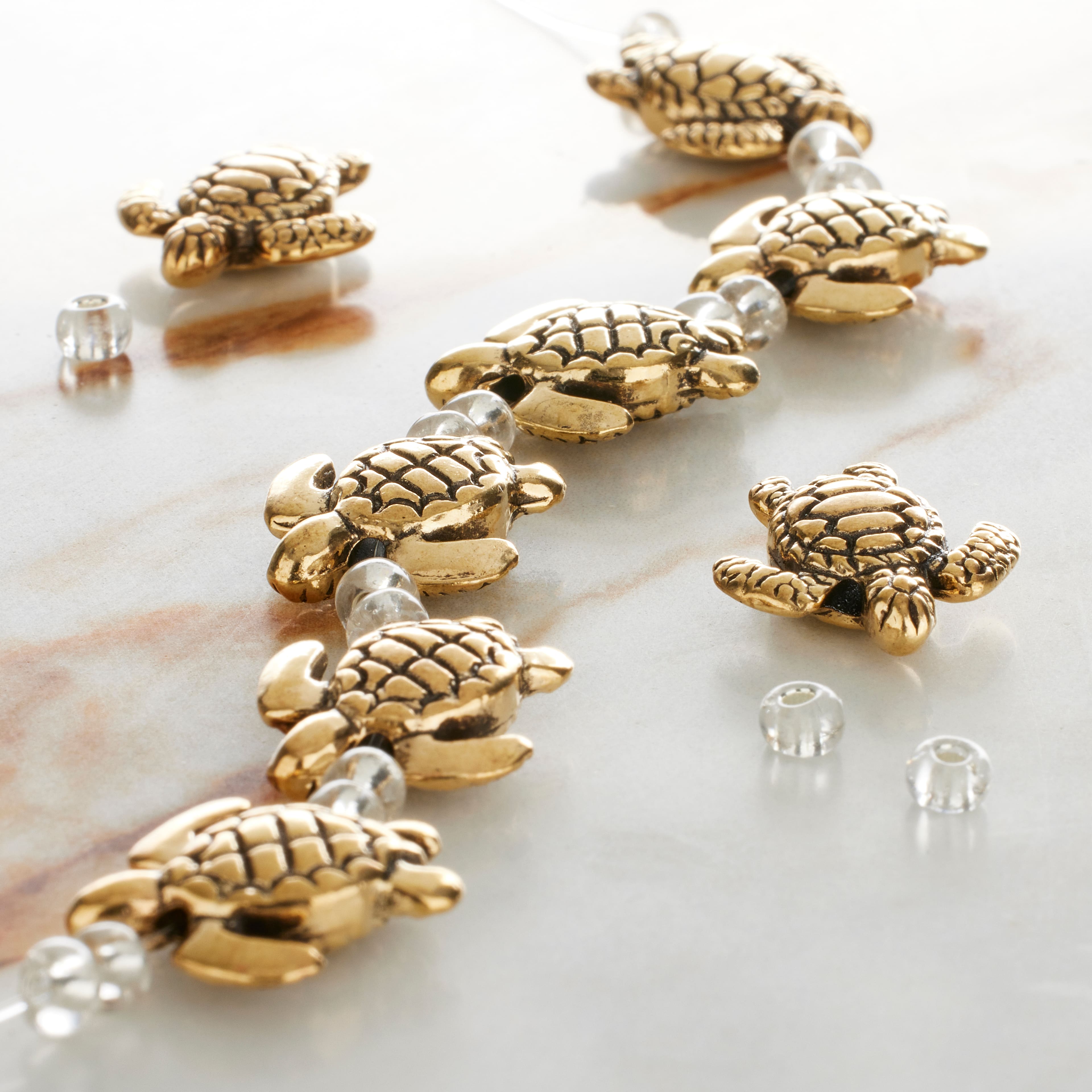 12 Packs: 8 ct. (96 total) Gold Metal Turtle Beads, 18mm by Bead Landing™