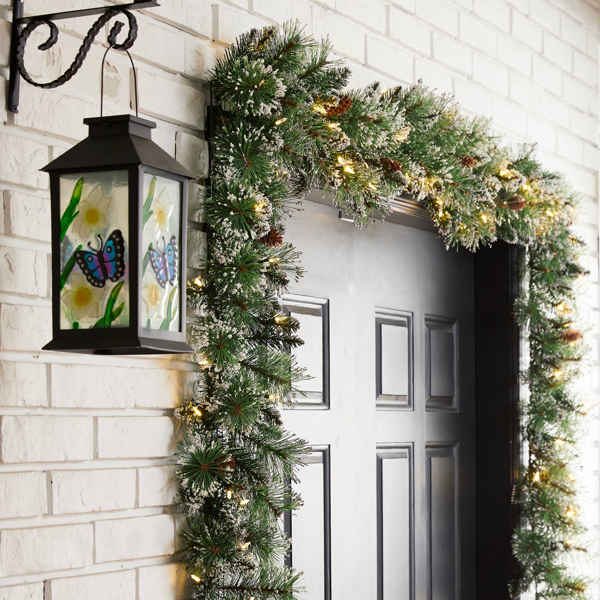 Glitzhome&#xAE; 9ft. Pre-Lit Frosted Greenery Pinecones Christmas Garland with Timer
