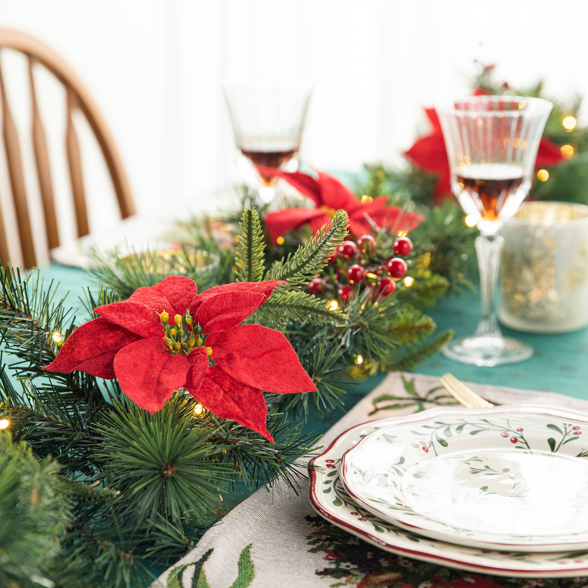 Glitzhome&#xAE; 9ft. Pre-Lit Greenery Pine Poinsettia and Berries Christmas Garland with LED Lights and Timer