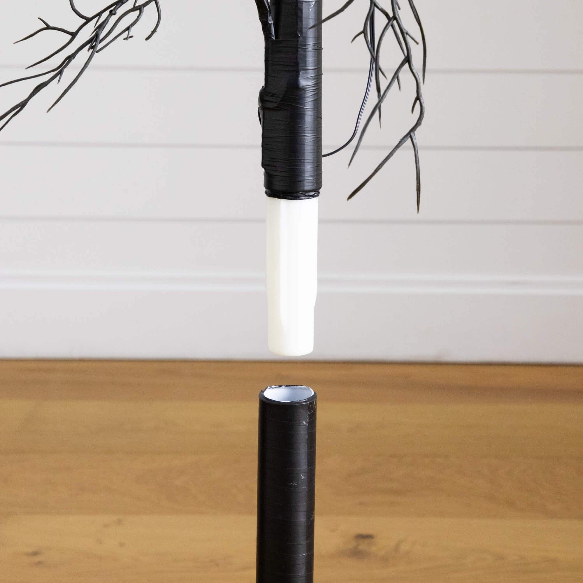 4ft. Pre-Lit Artificial Halloween Black Twig Tree with 24 Orange LED Pumpkin Shaped Lights