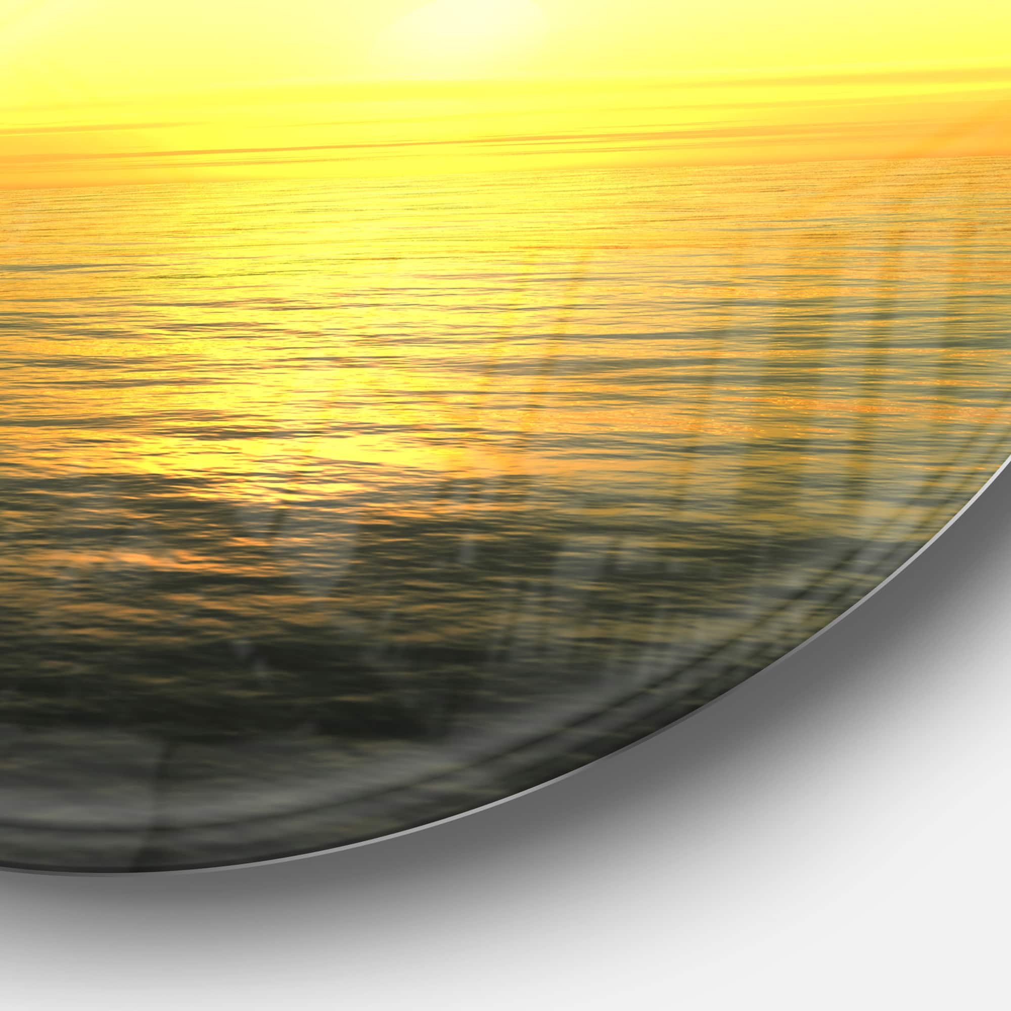 Designart - Brilliant Yellow Sunrise over Waters' Beach Photo Metal Circle Wall Art