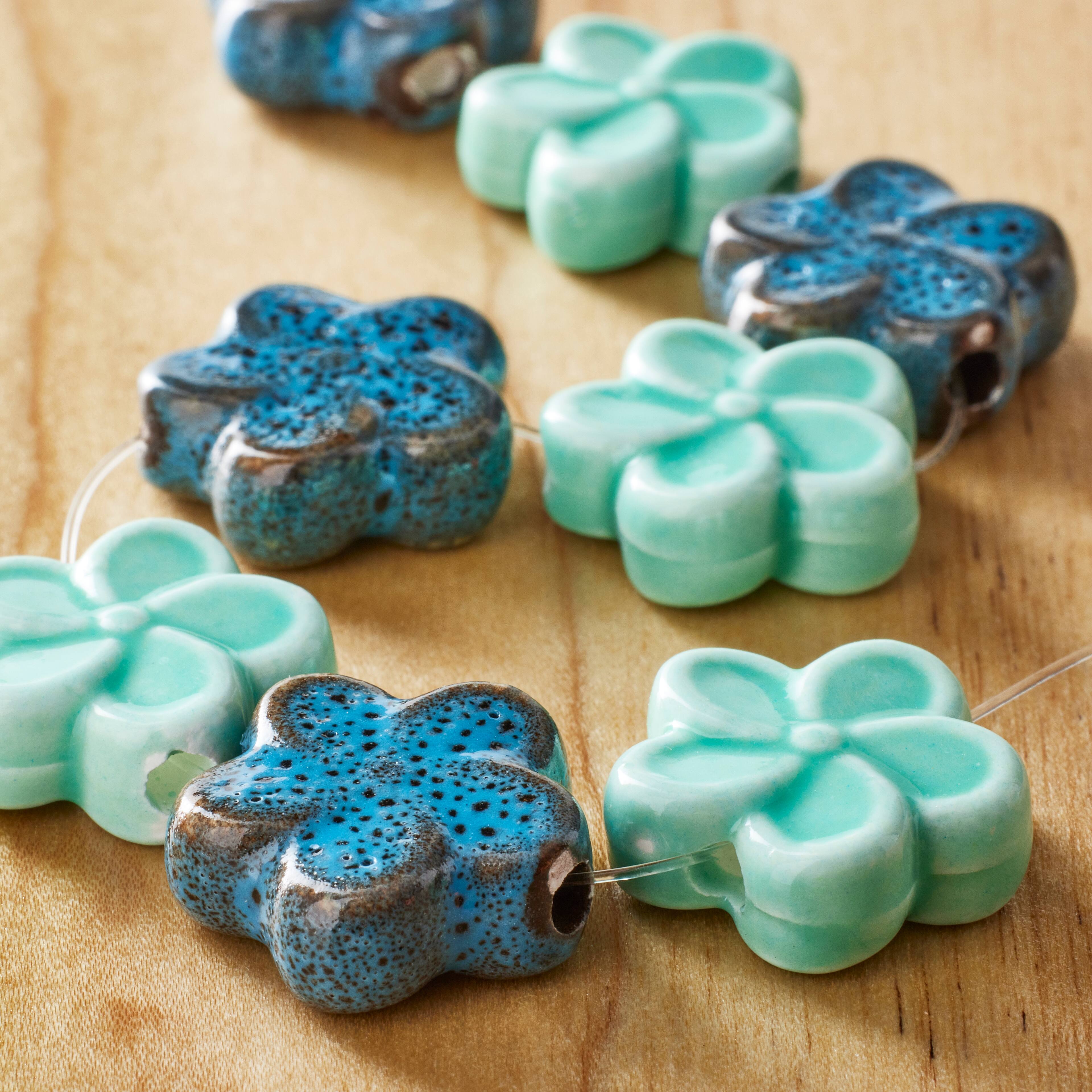 12 Packs: 8 ct. (96 total) Aqua Mix Flower Ceramic Beads, 18mm by Bead Landing™