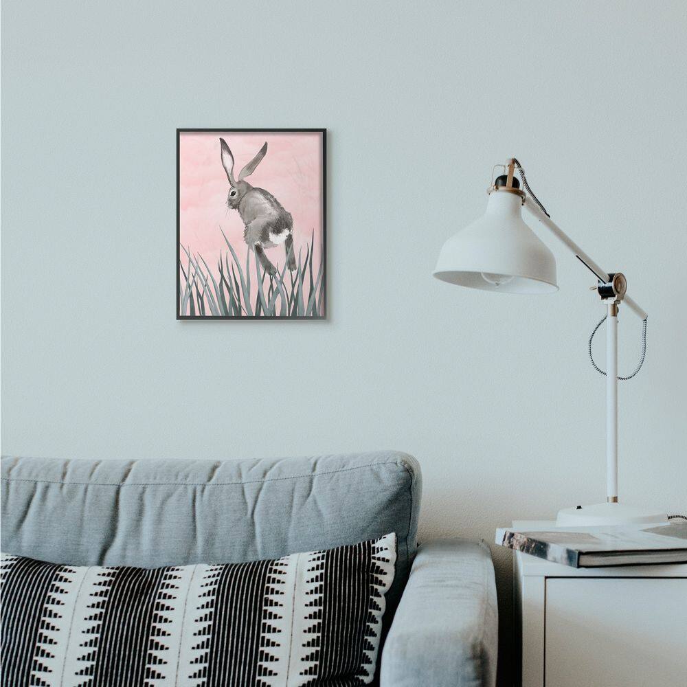 Stupell Industries Bunny Rabbit Jump Grass Wall Art in Black Frame